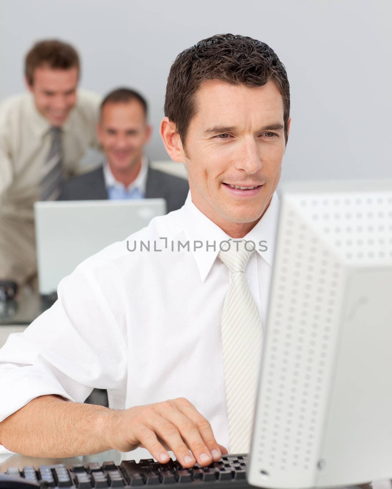 Businessman working with a computer in the office by Wavebreakmedia