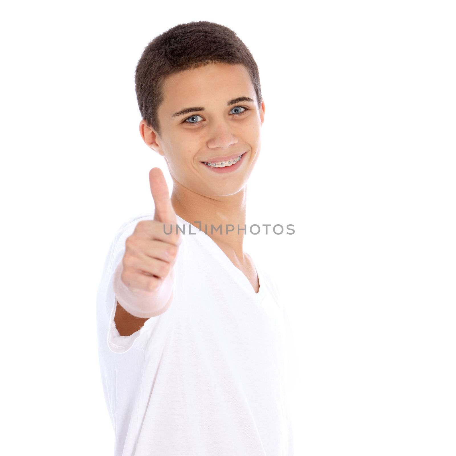 Smiling teenage boy giving thumbs up by Farina6000