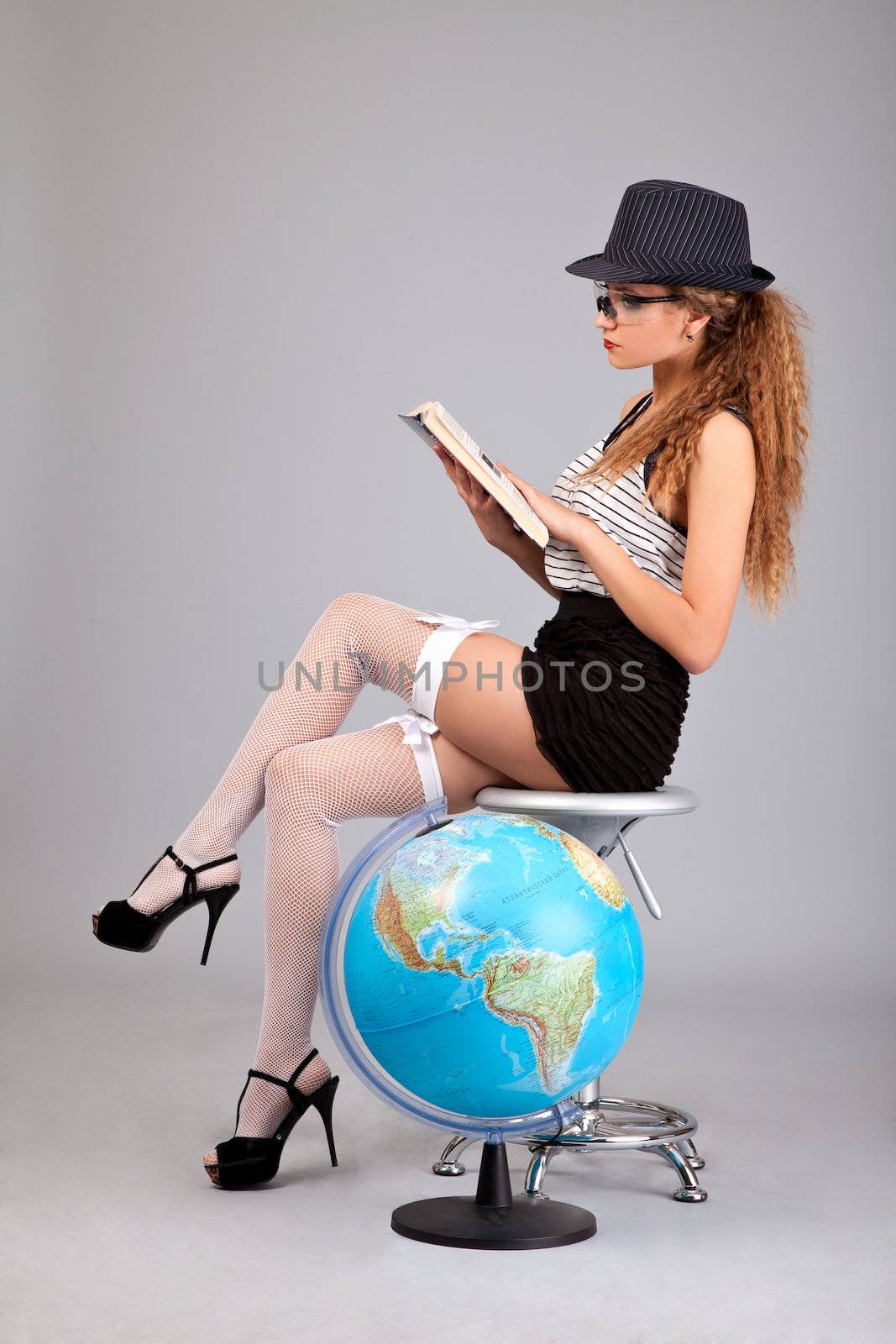 Sexy teacher holding a book on grey by bloodua