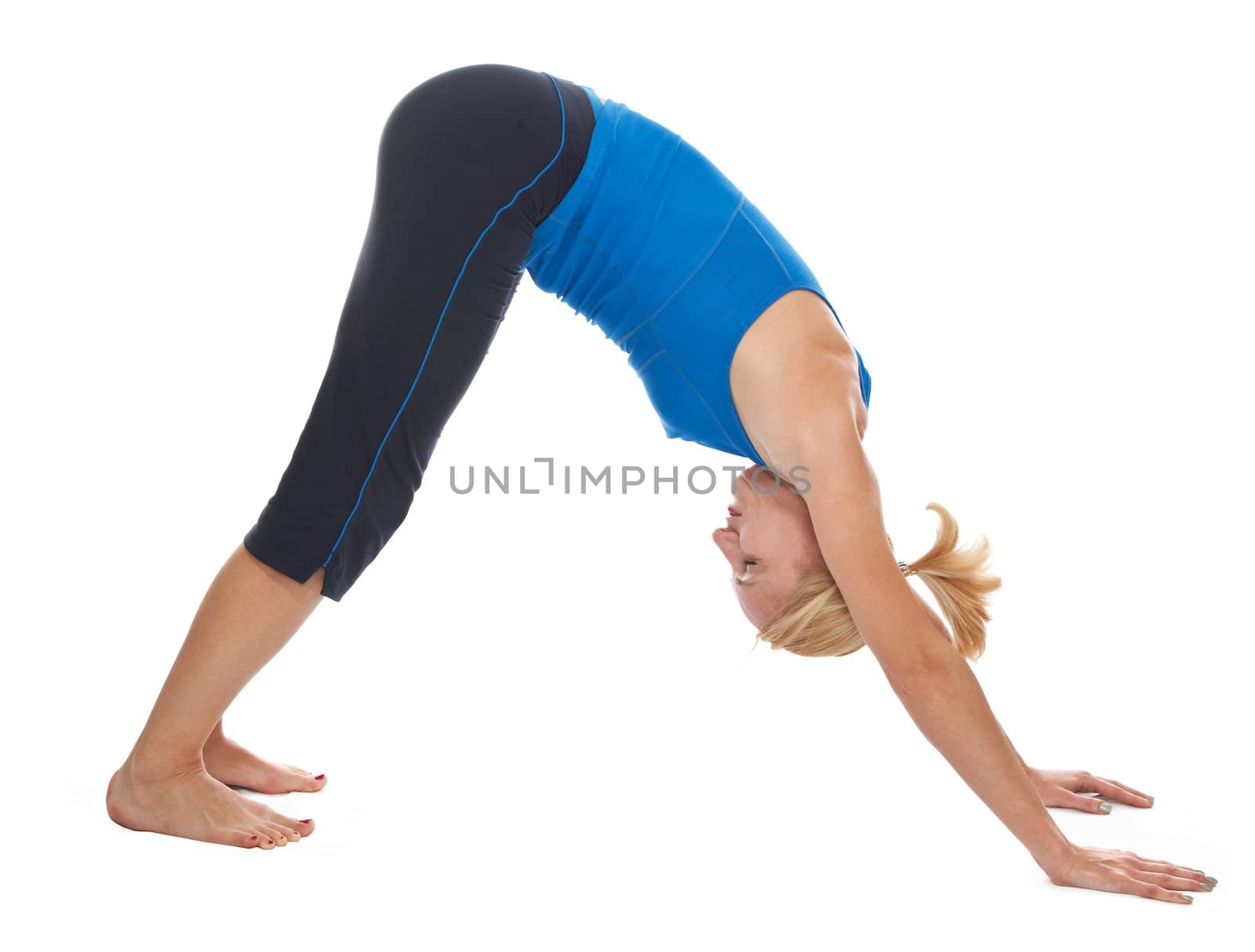 Practicing Yoga. Young woman isolated on white background