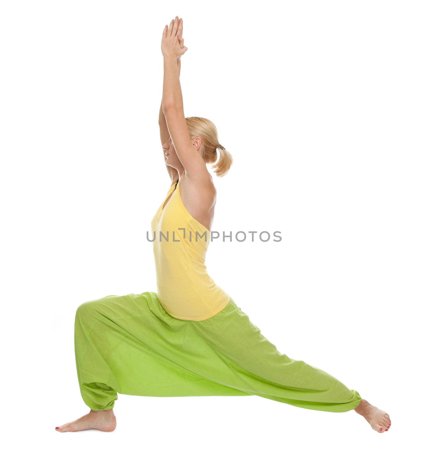 Practicing Yoga. Young woman by bloodua