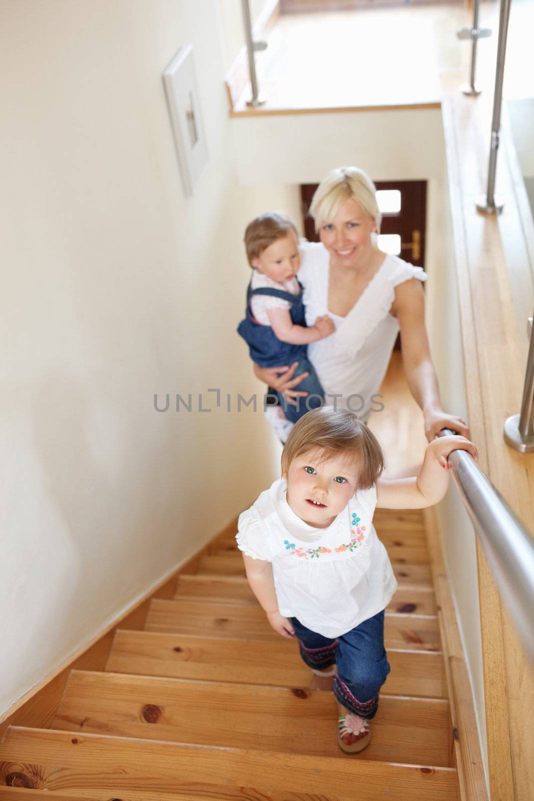 Family going upstairs by Wavebreakmedia