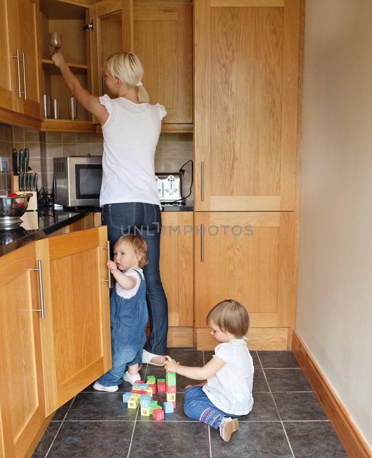 Family in the kitchen by Wavebreakmedia