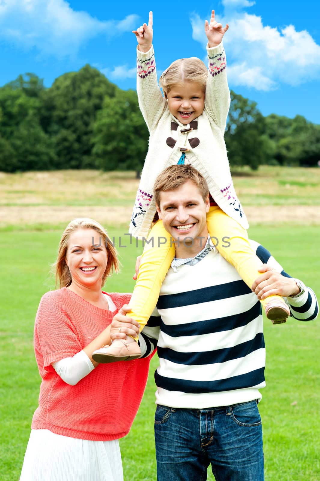 Family enjoying summer day during vacations by stockyimages