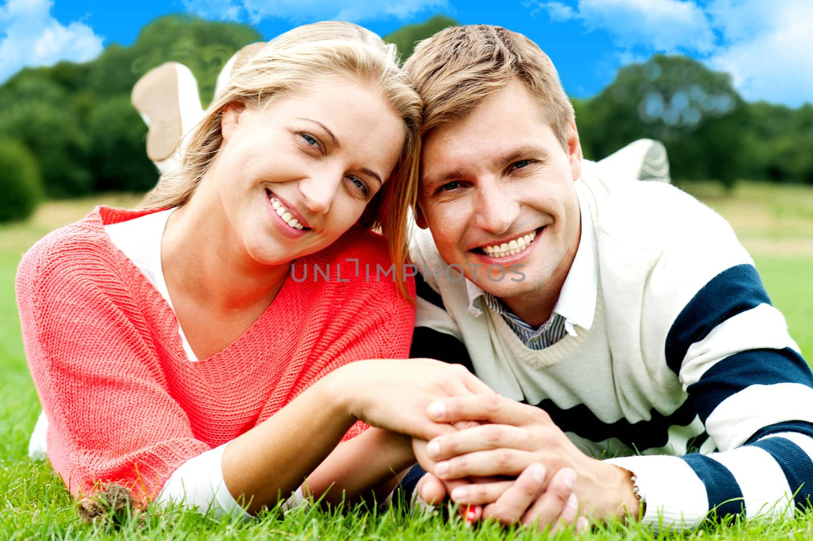 Young beautiful couple loving each other in nature by stockyimages