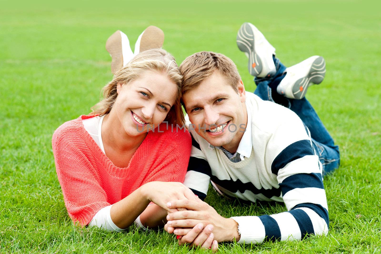 Couple outdoors enjoying the fresh air. Facing camera with a smile