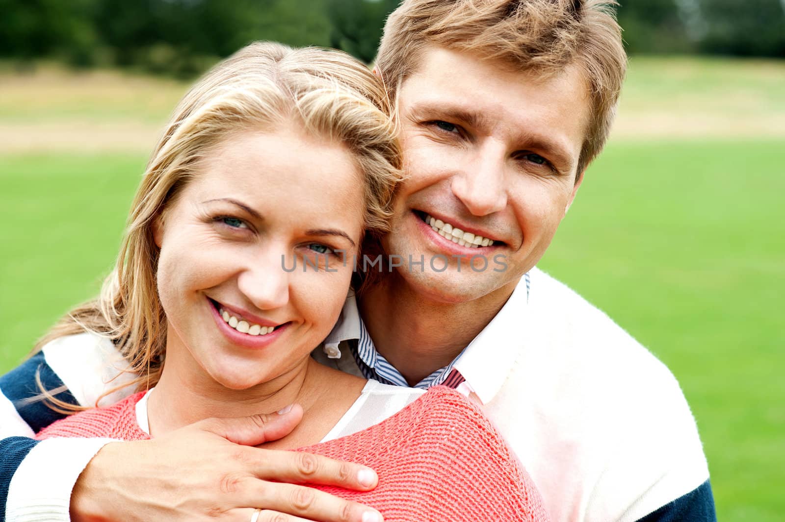 Couple embracing in love. Bonding and true love. Husband hugging from back