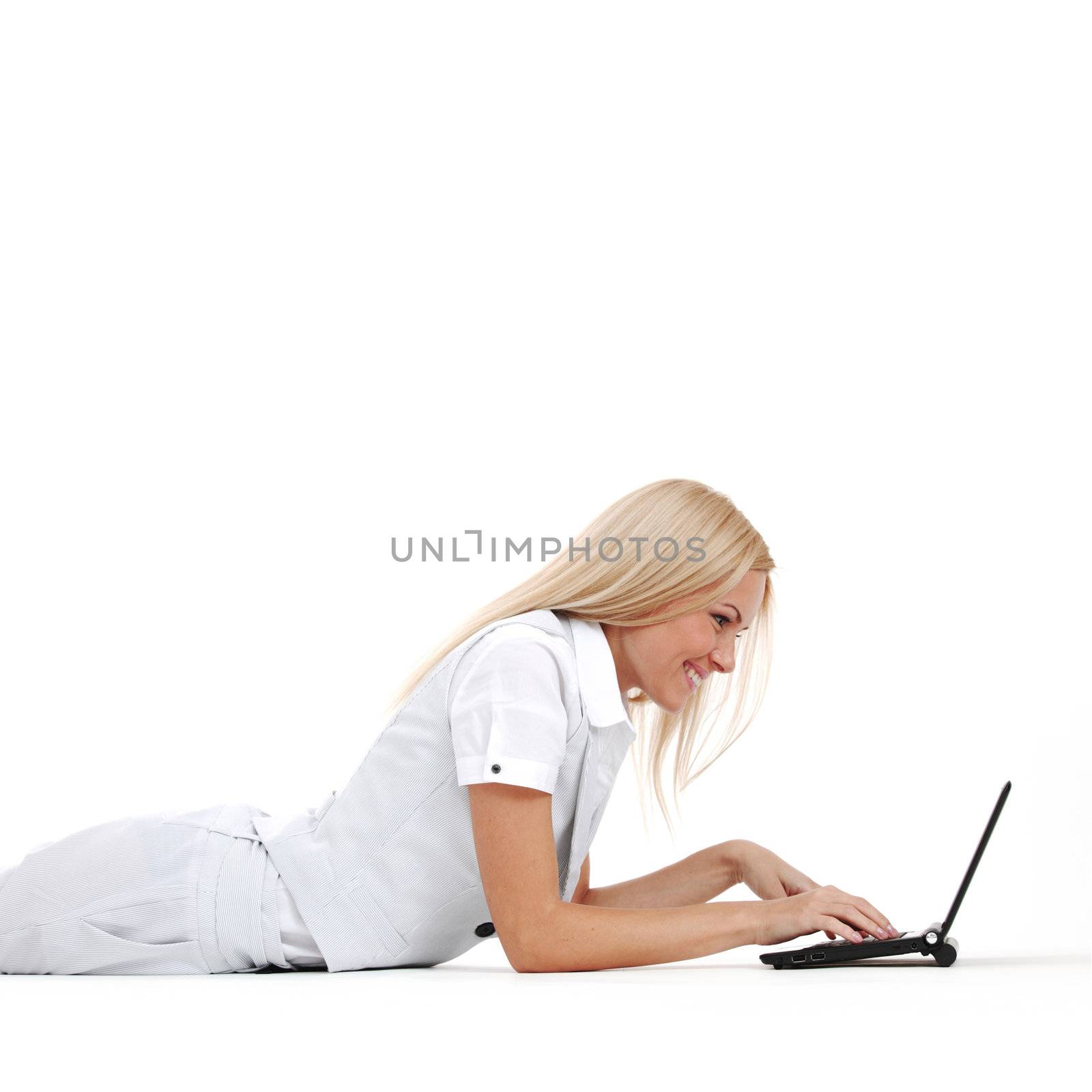 business woman lies and working on laptop