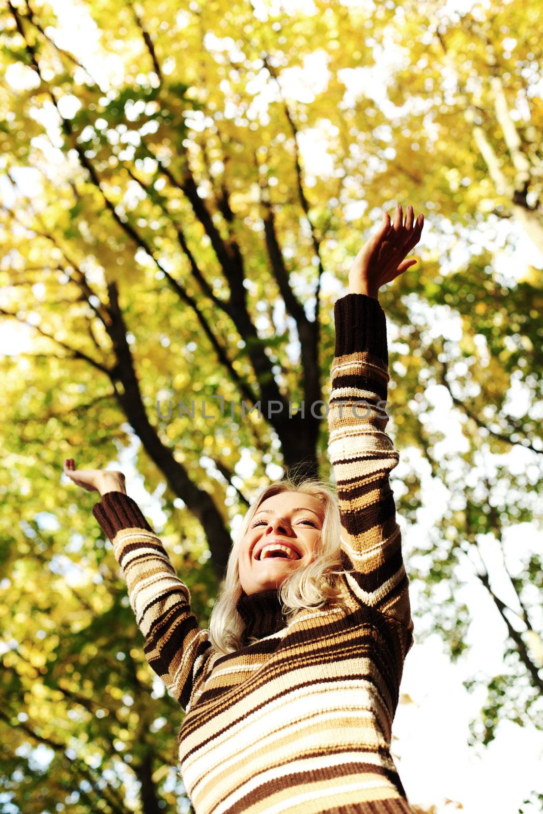 autumn woman hands in the air