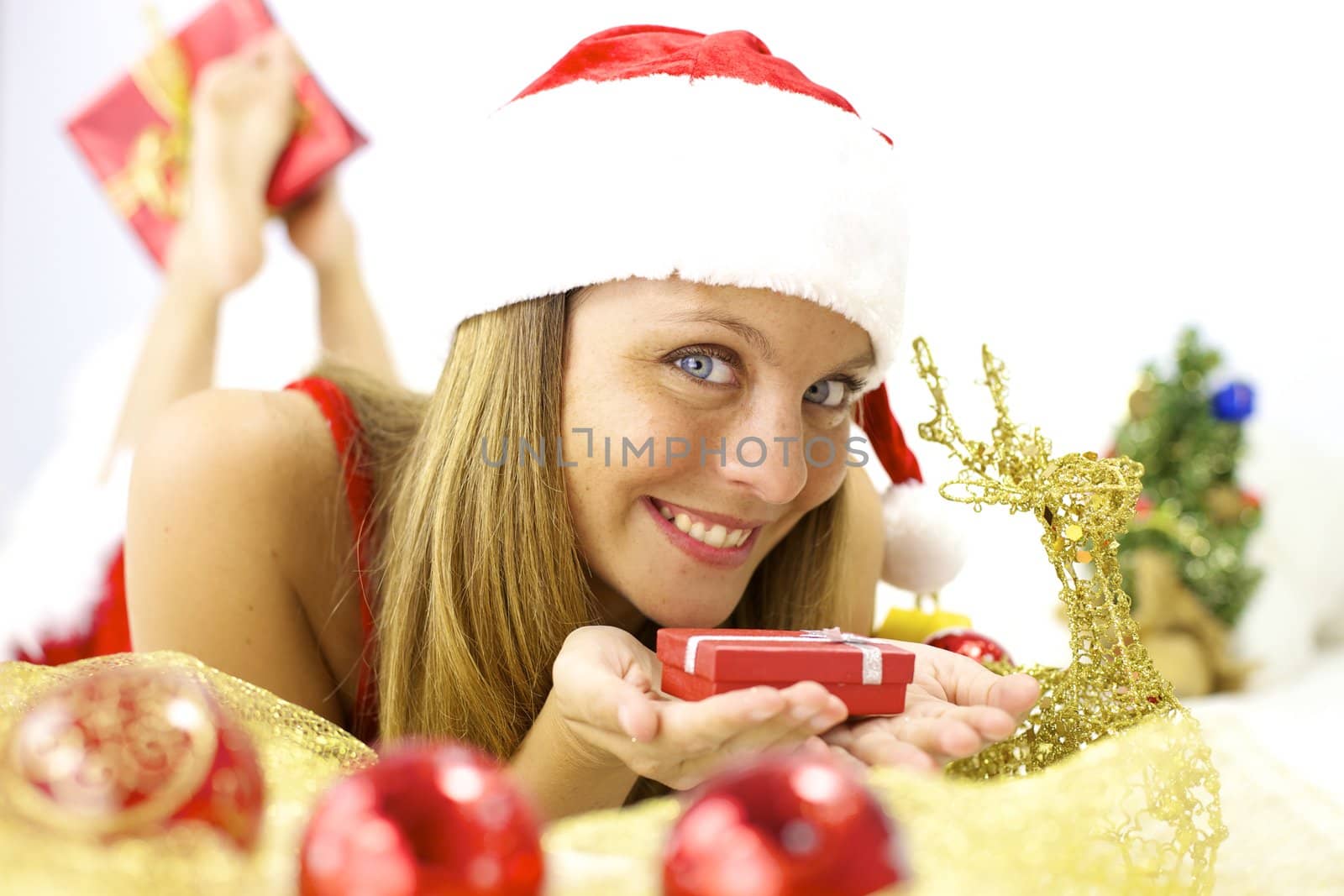 Gorgeous female Santa Claus happy for Christmas night