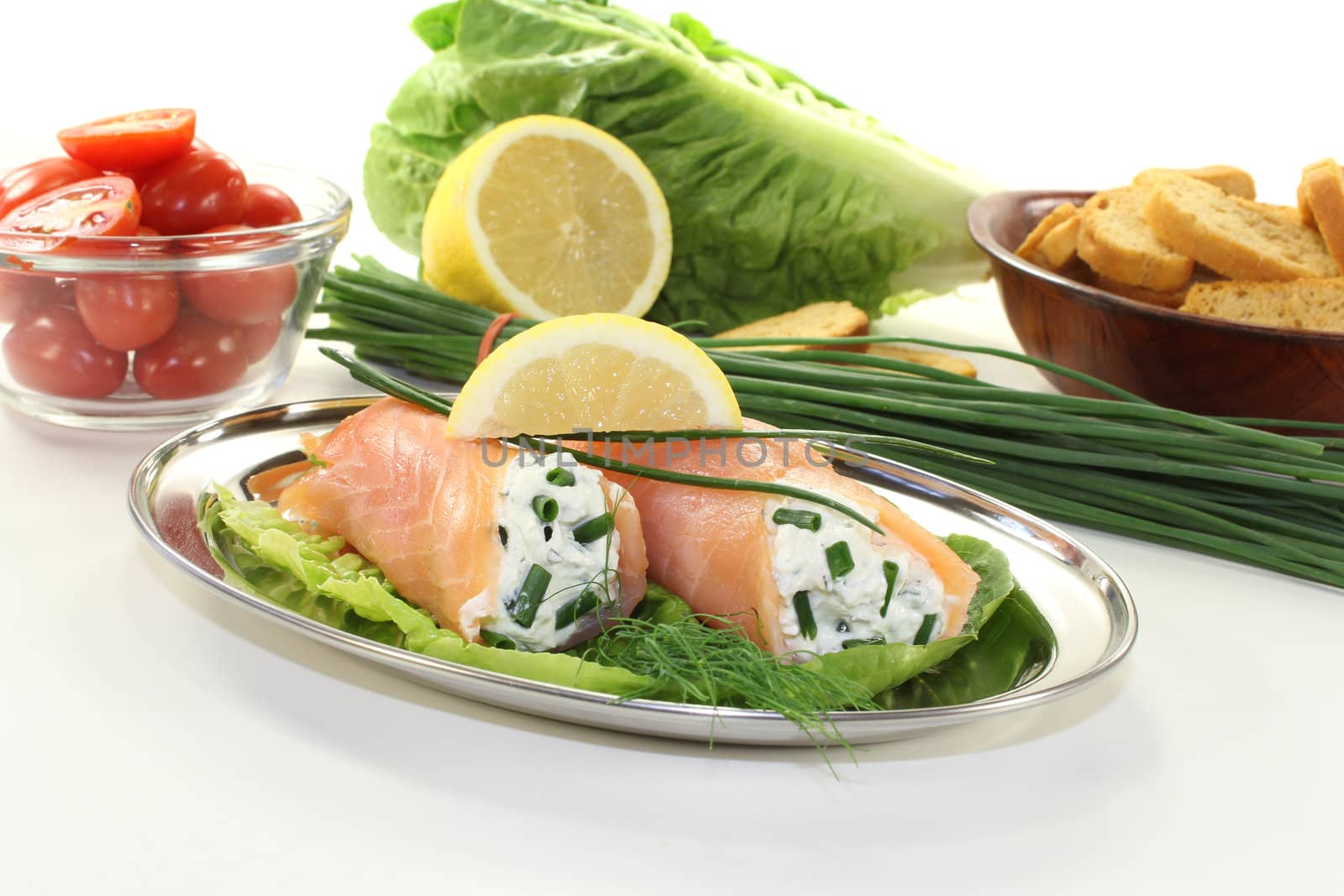stuffed salmon rolls with cream cheese, chives and a lemon slice