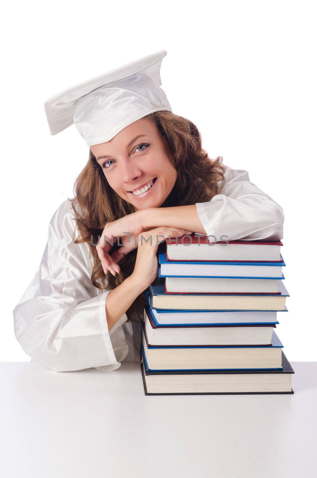 Happy graduate with lots of books on white