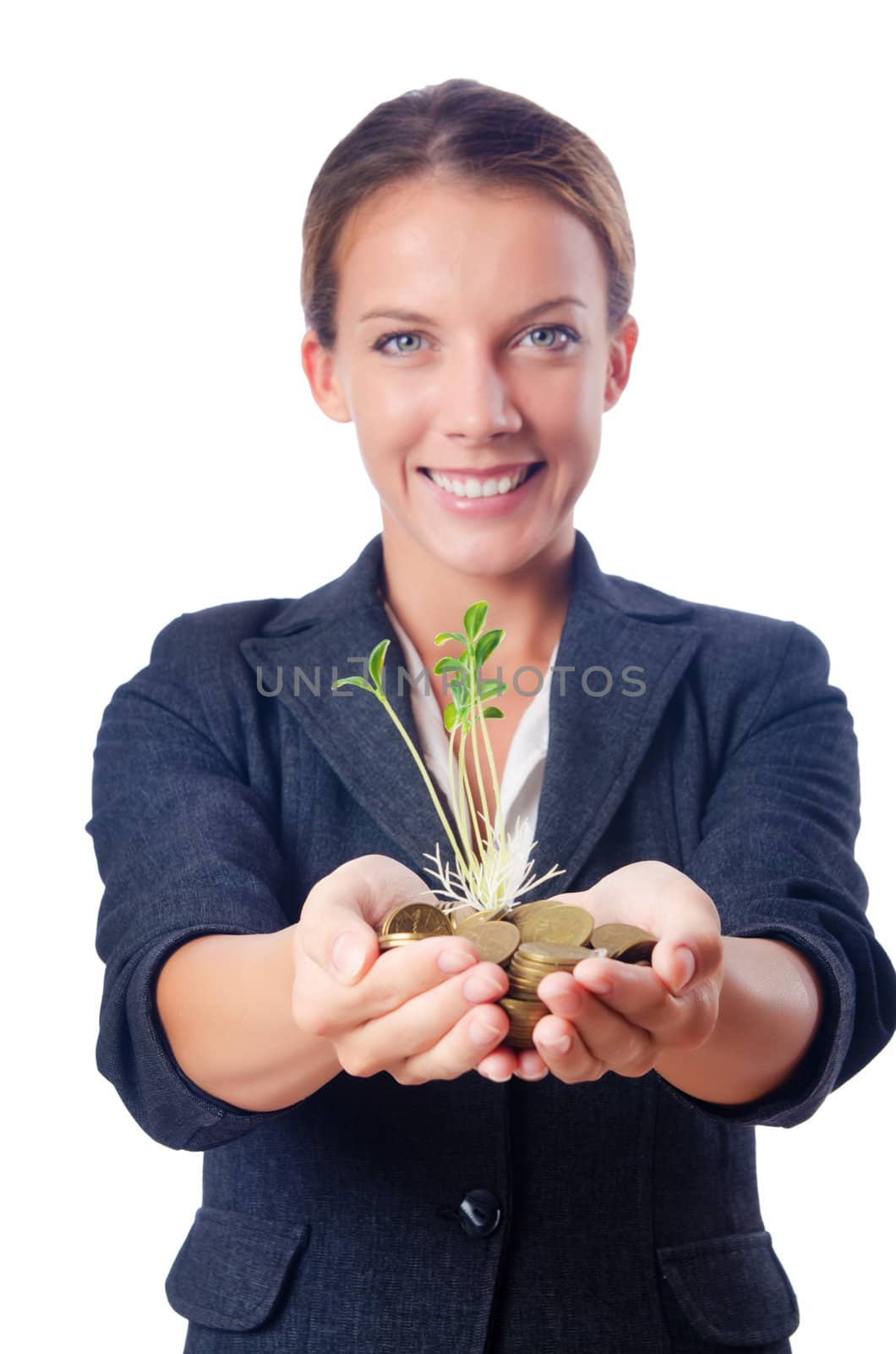 Businesswoman with seedlings and coins