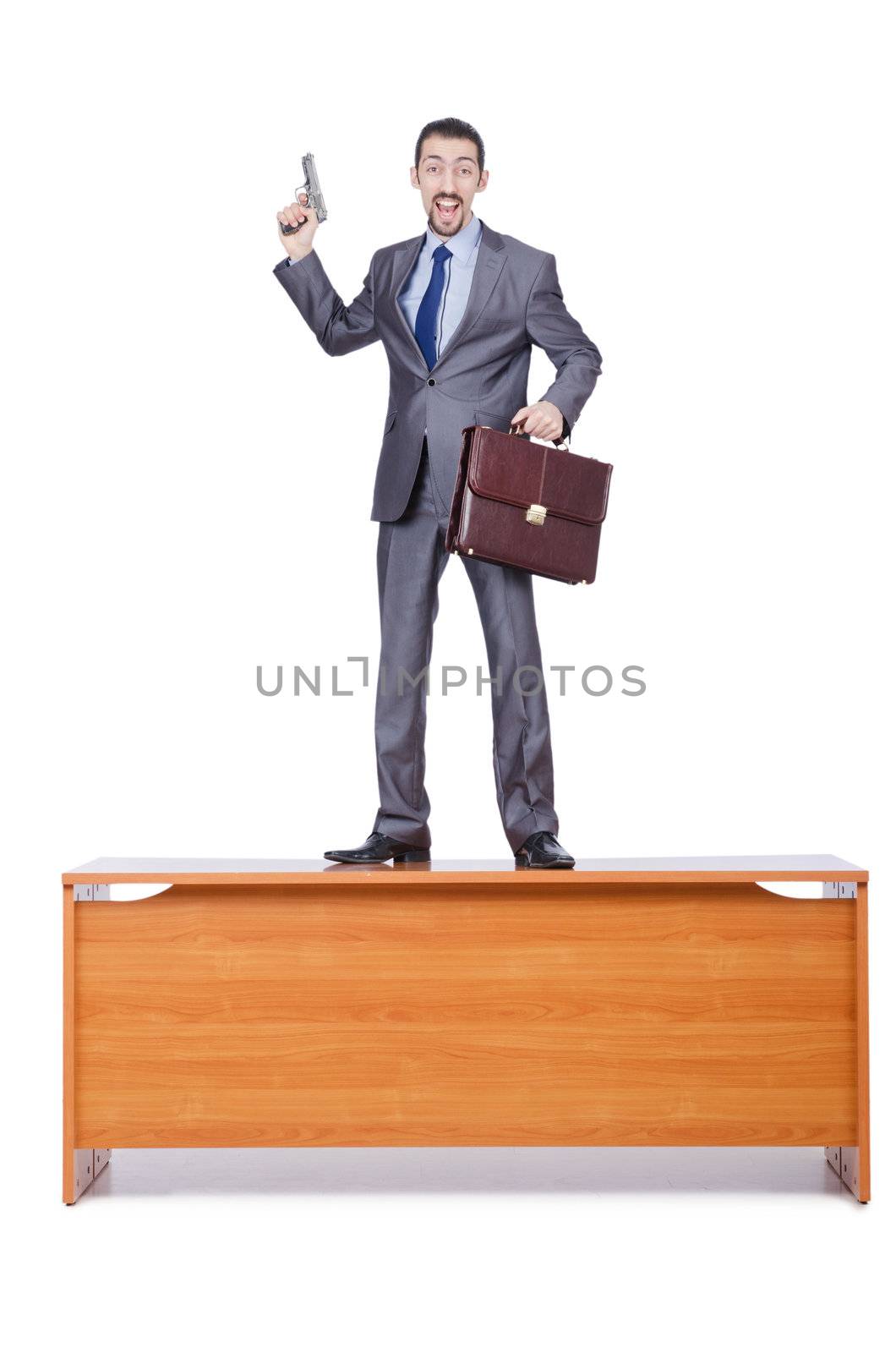 Businessman with gun on white