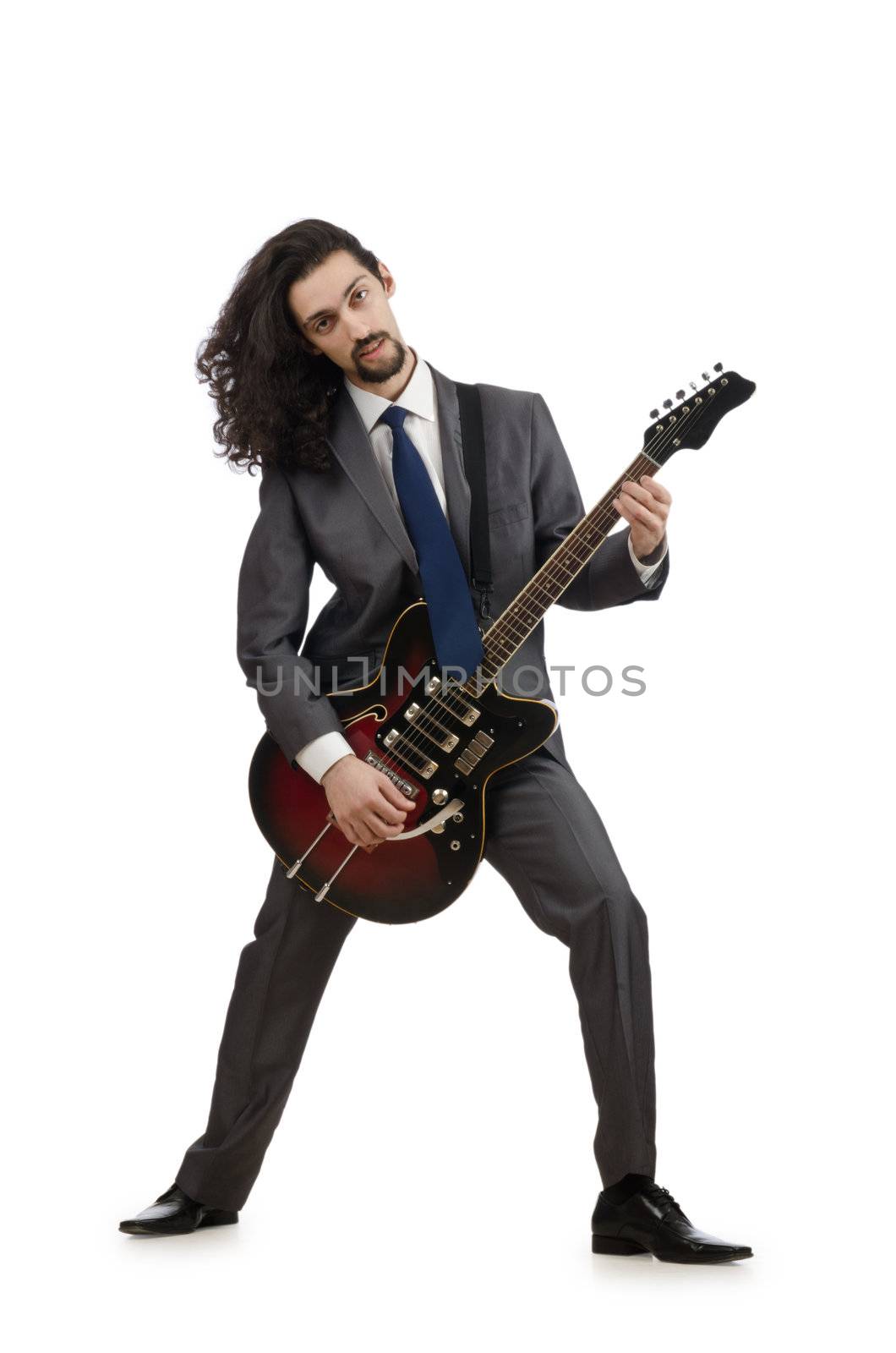 Guitar player in business suit on white