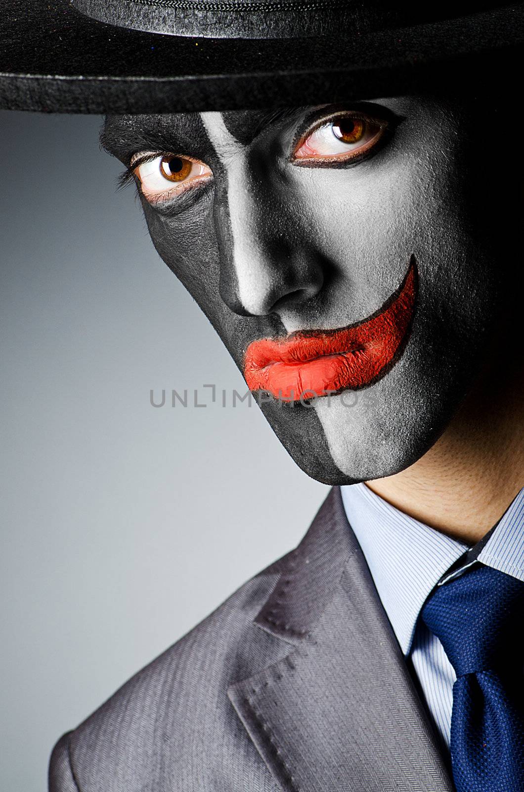 Businessman with clown face paint by Elnur