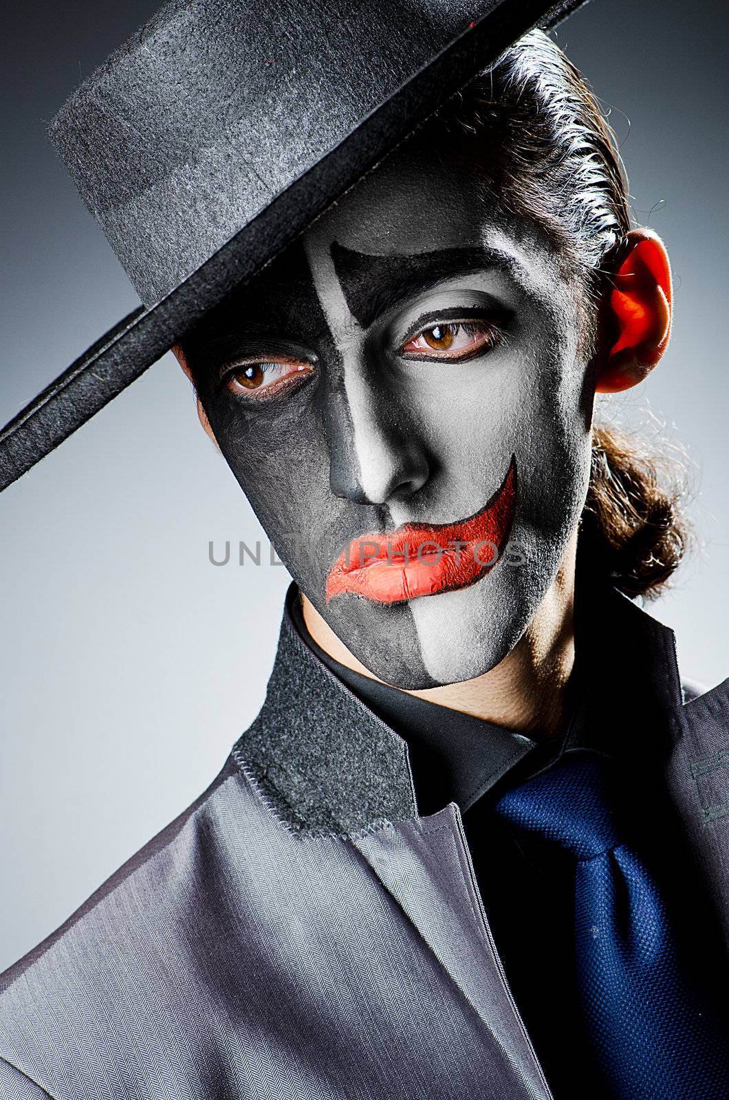 Businessman with clown face paint by Elnur