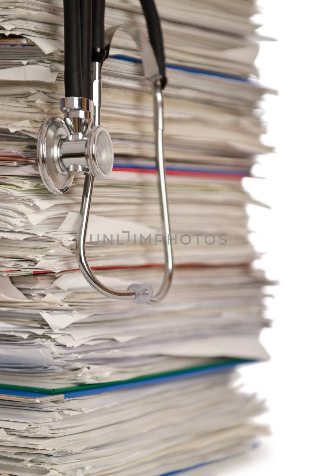 Stack of papers with stethoscope by Elnur