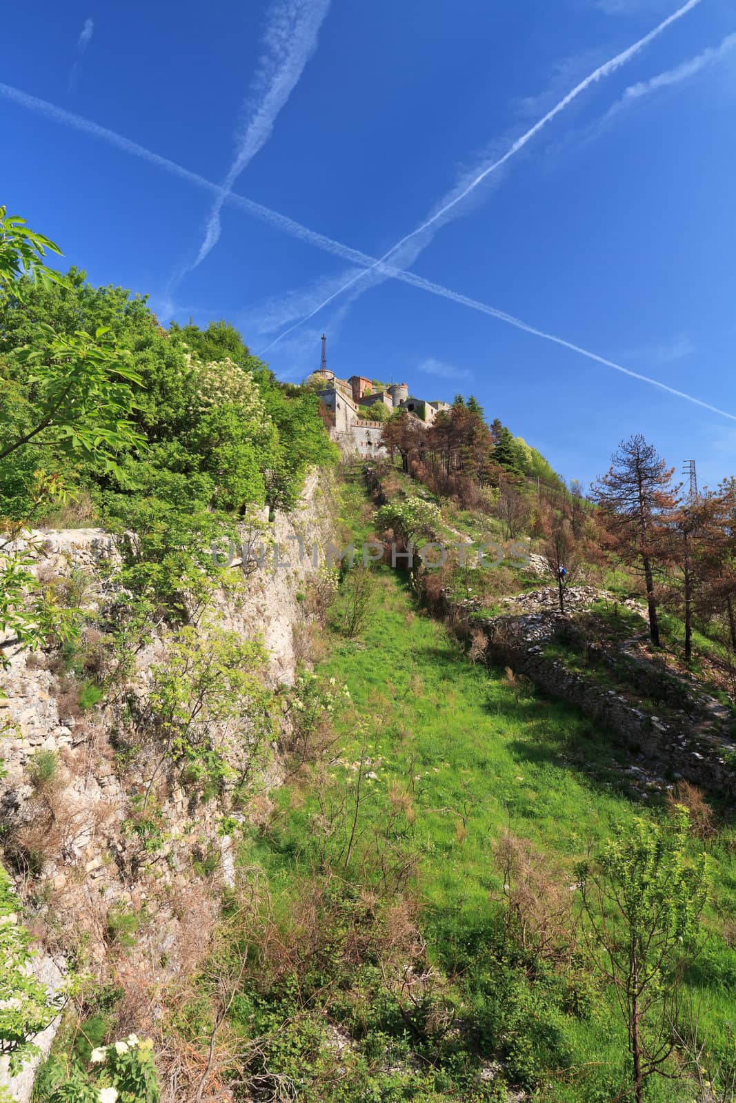 walls and moat of Sperone Castle, a medieval fortress built over Genova, Liguria, Italy