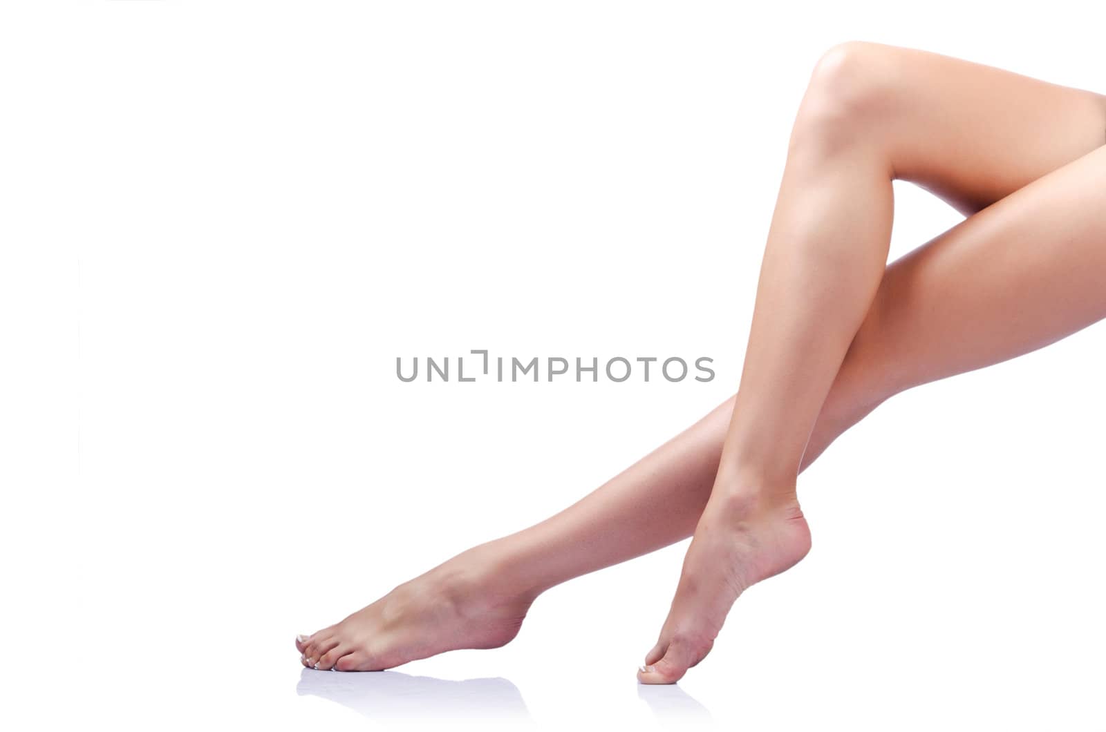 Long woman legs isolated on white by Elnur