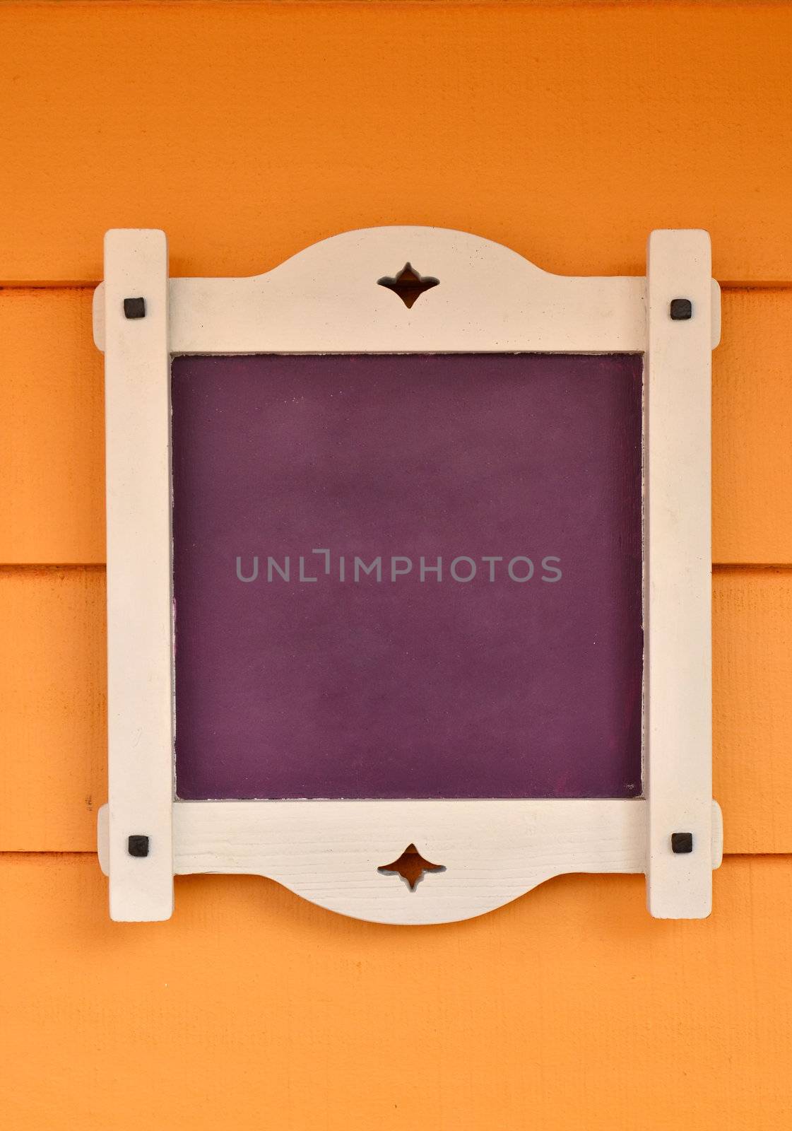 purple board on orange wood wall