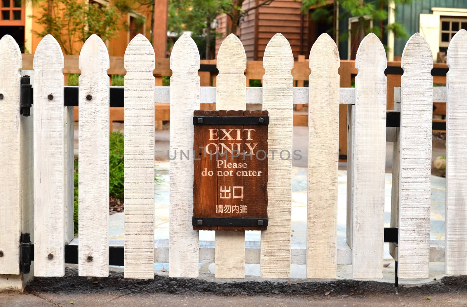 white picket fence and home