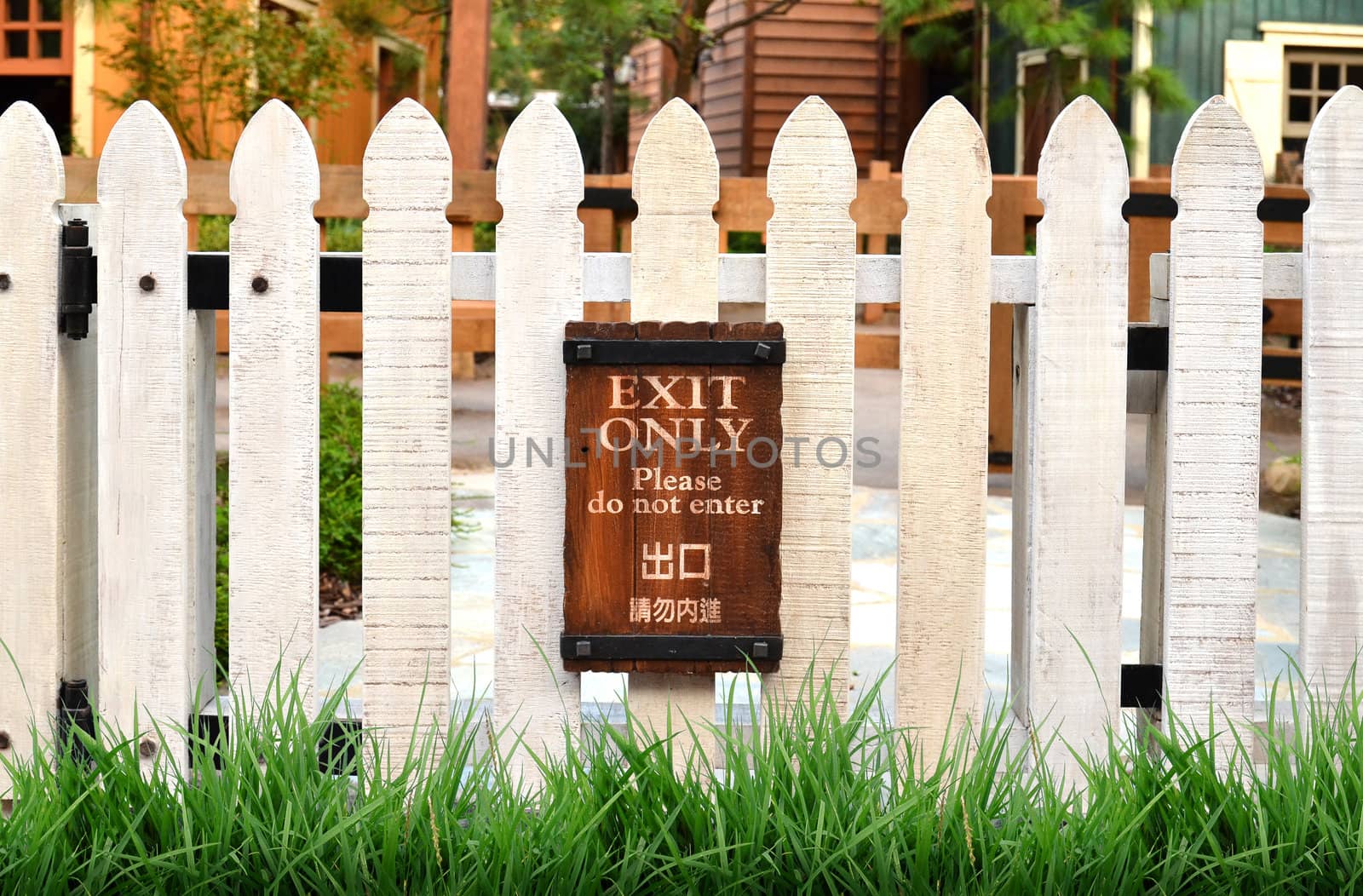 white picket fence and home