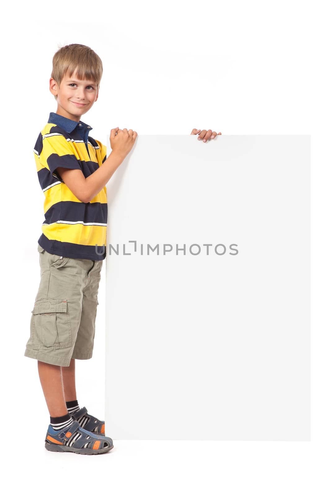 Boy holding a banner isolated on white background. Back to school