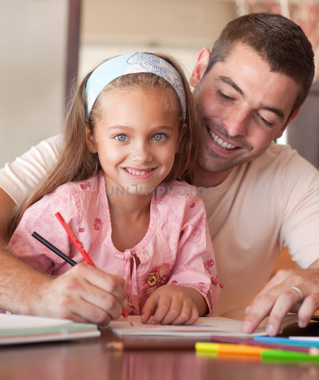 Family drawing with colourful pen together a picture