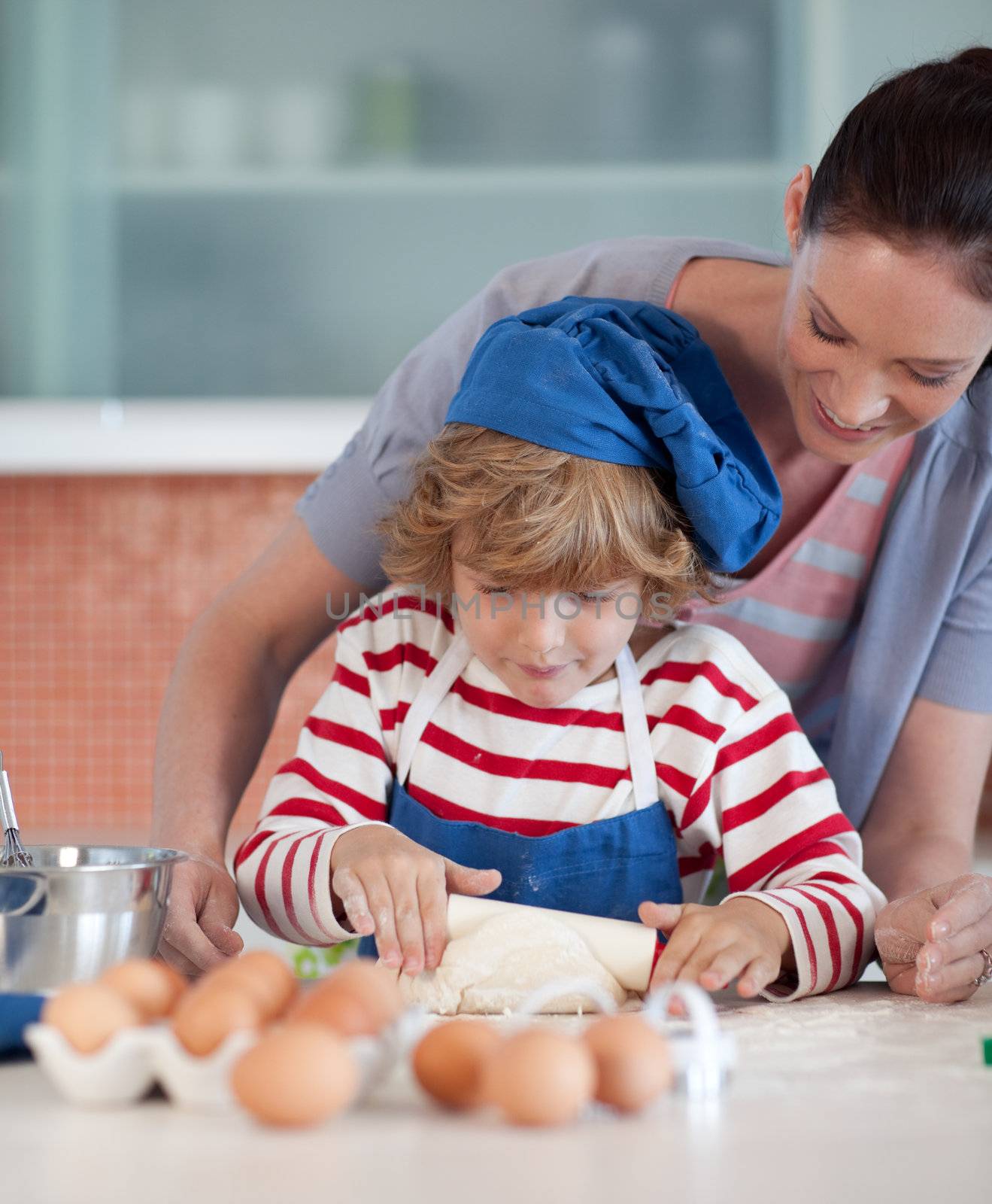 Jolly family making cookies in the kitchen