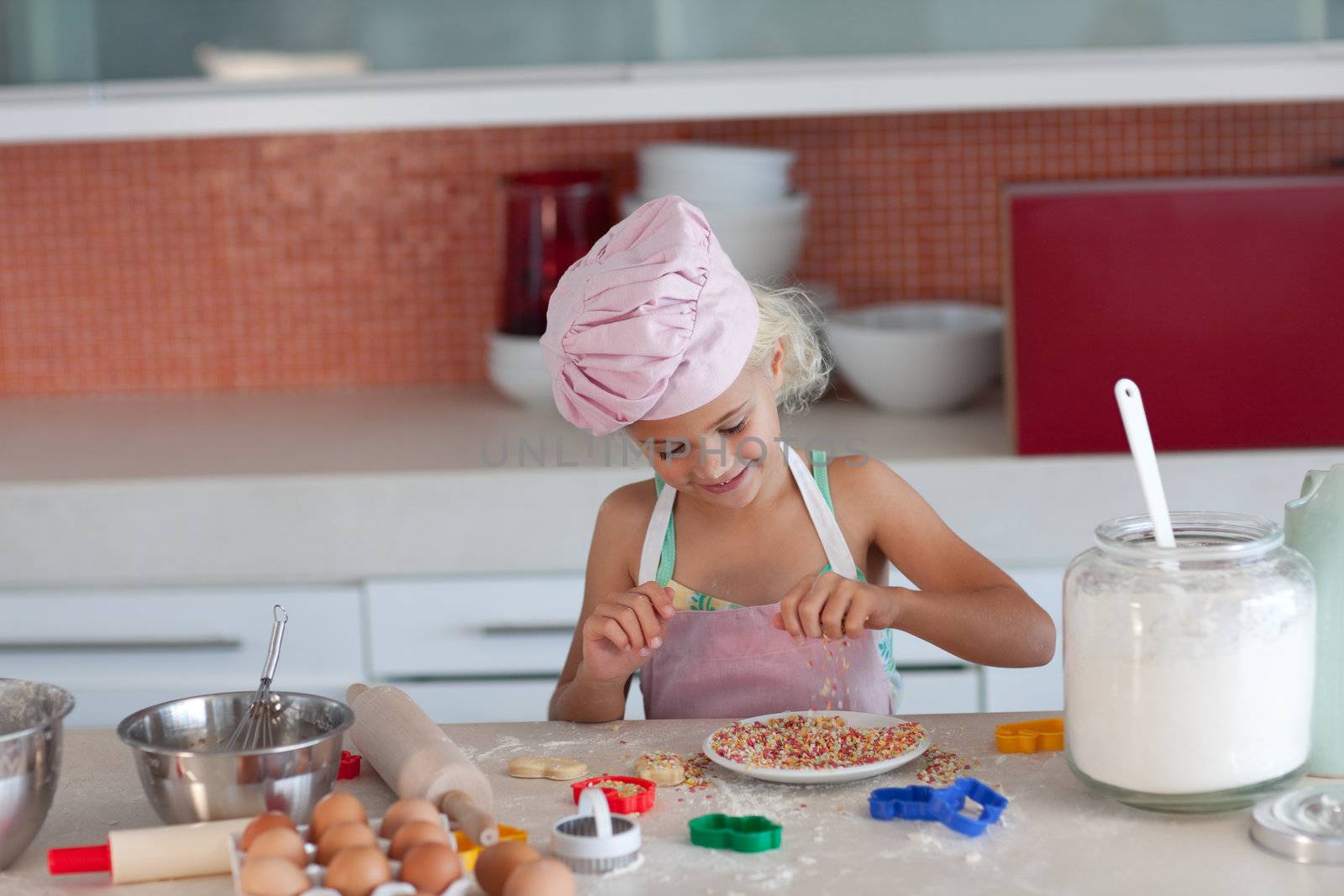 Blond girl baking biscuits for her family by Wavebreakmedia