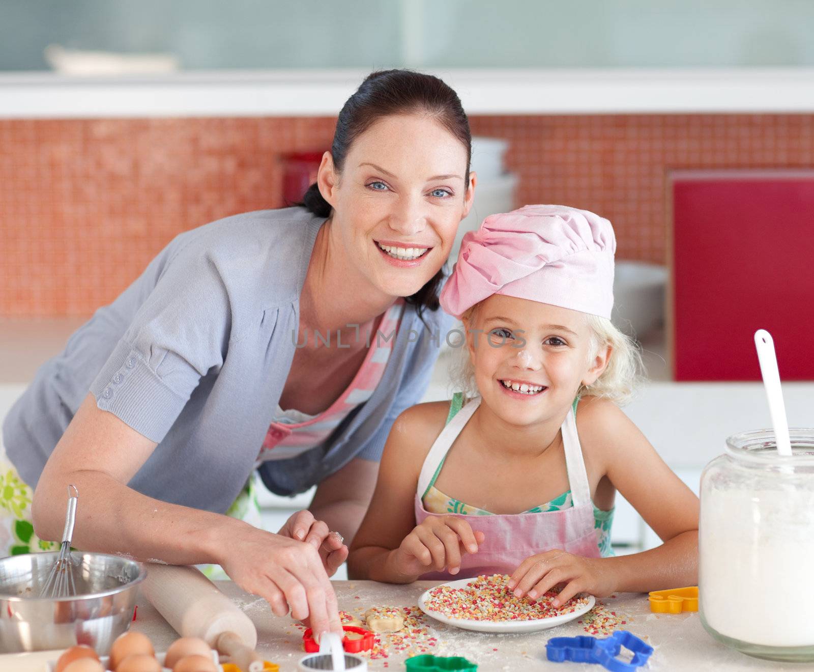 Portrait of family baking cookies by Wavebreakmedia