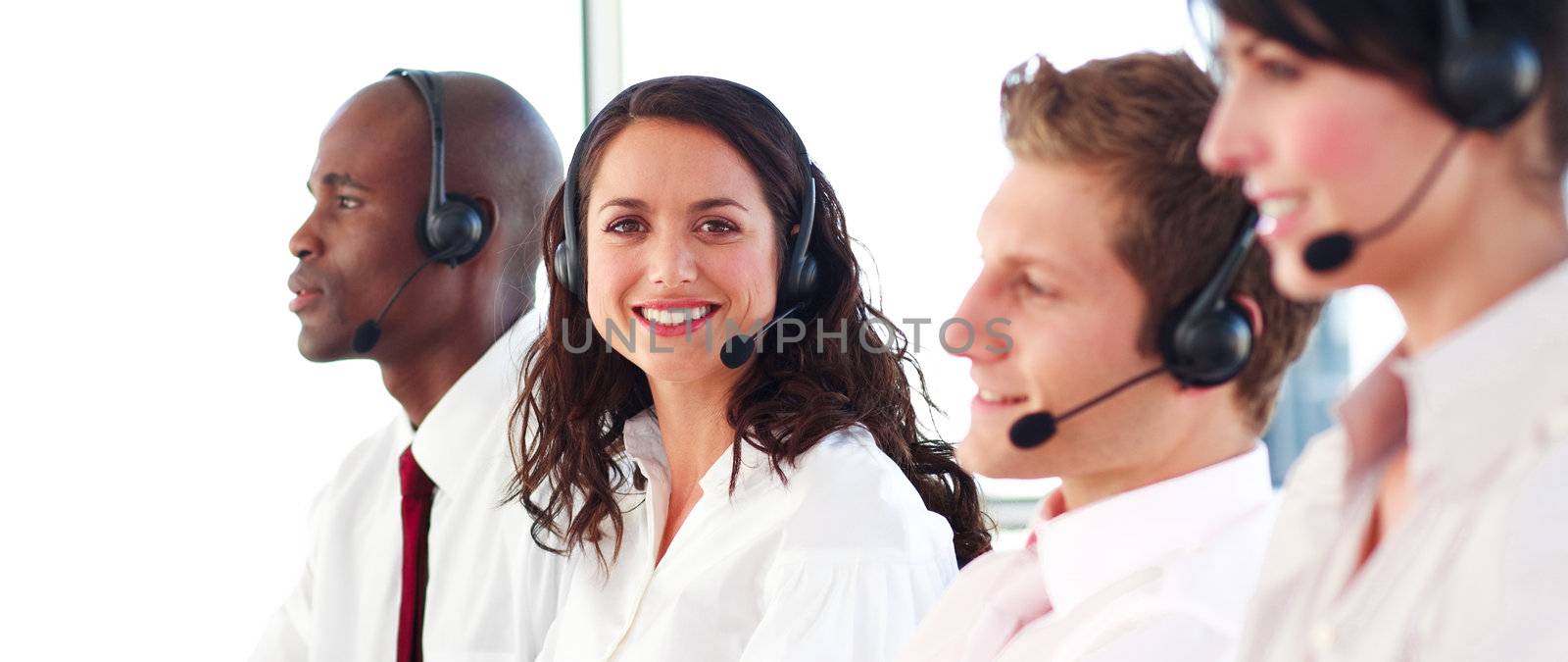 Portrait of a joyful sale representative team at work in a office
