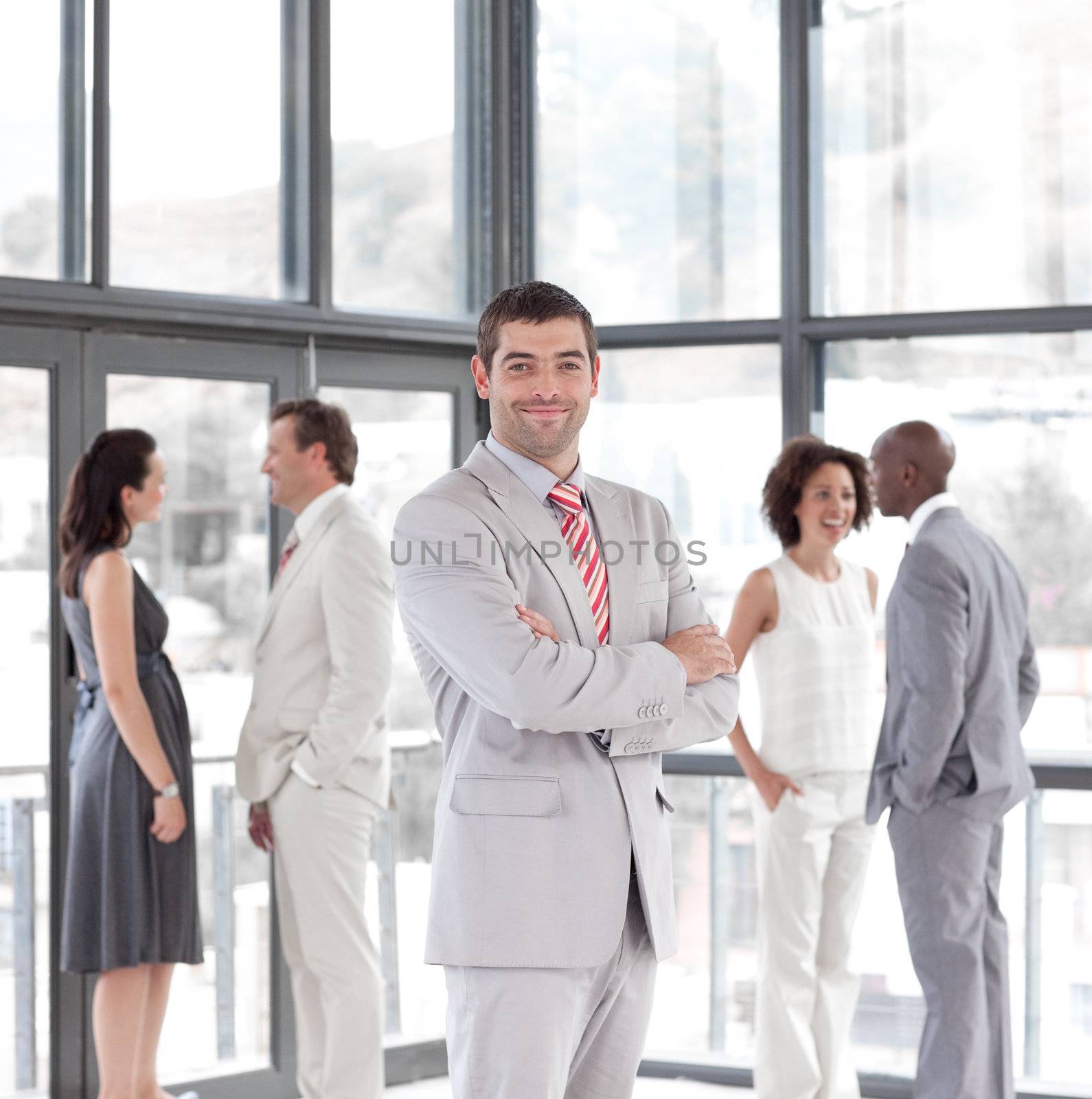 portrait of a hispanic male manager leading his team by Wavebreakmedia