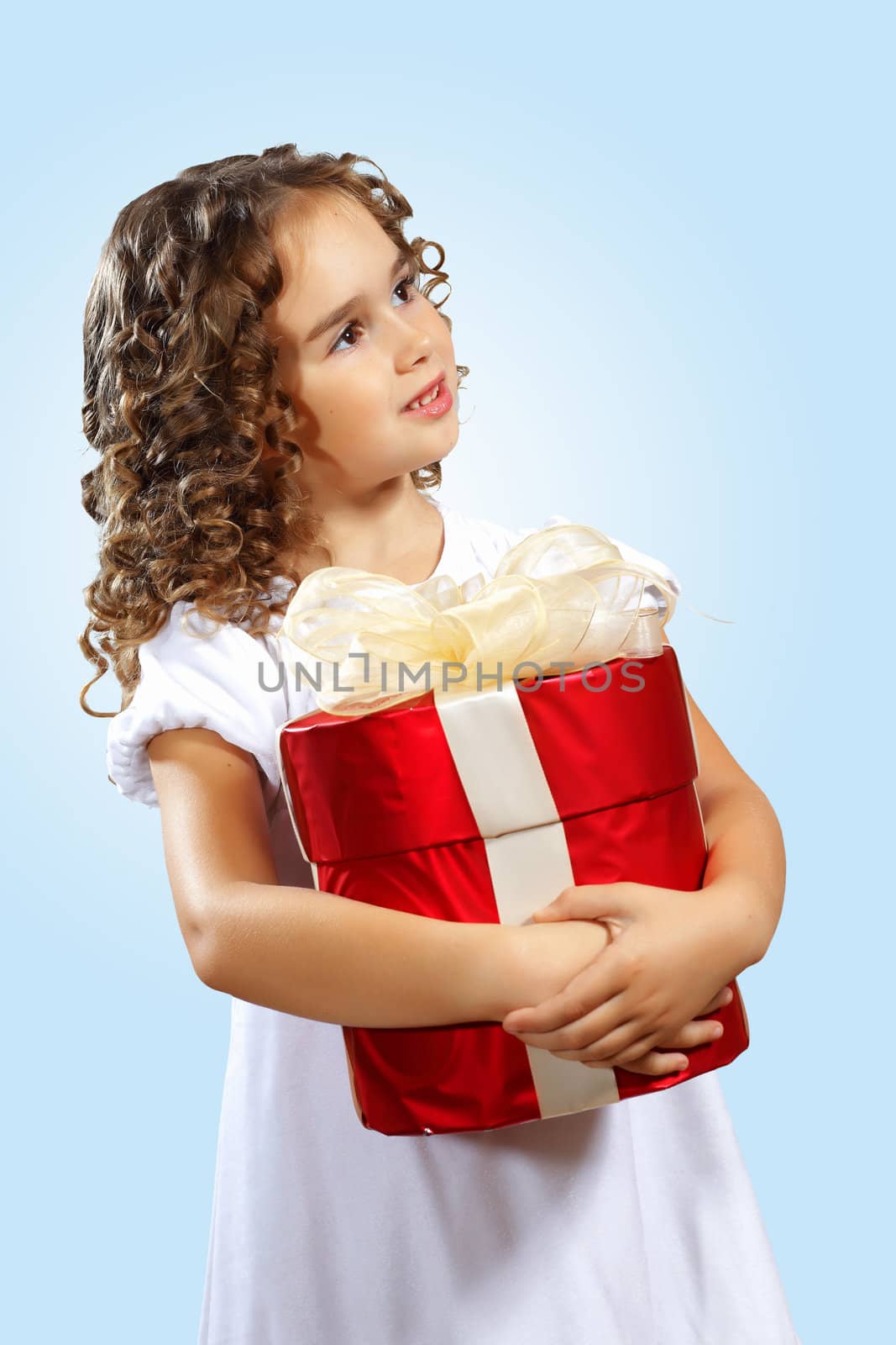 Portrait of an adorable preschool age girl wearing a Christmas holiday outfit