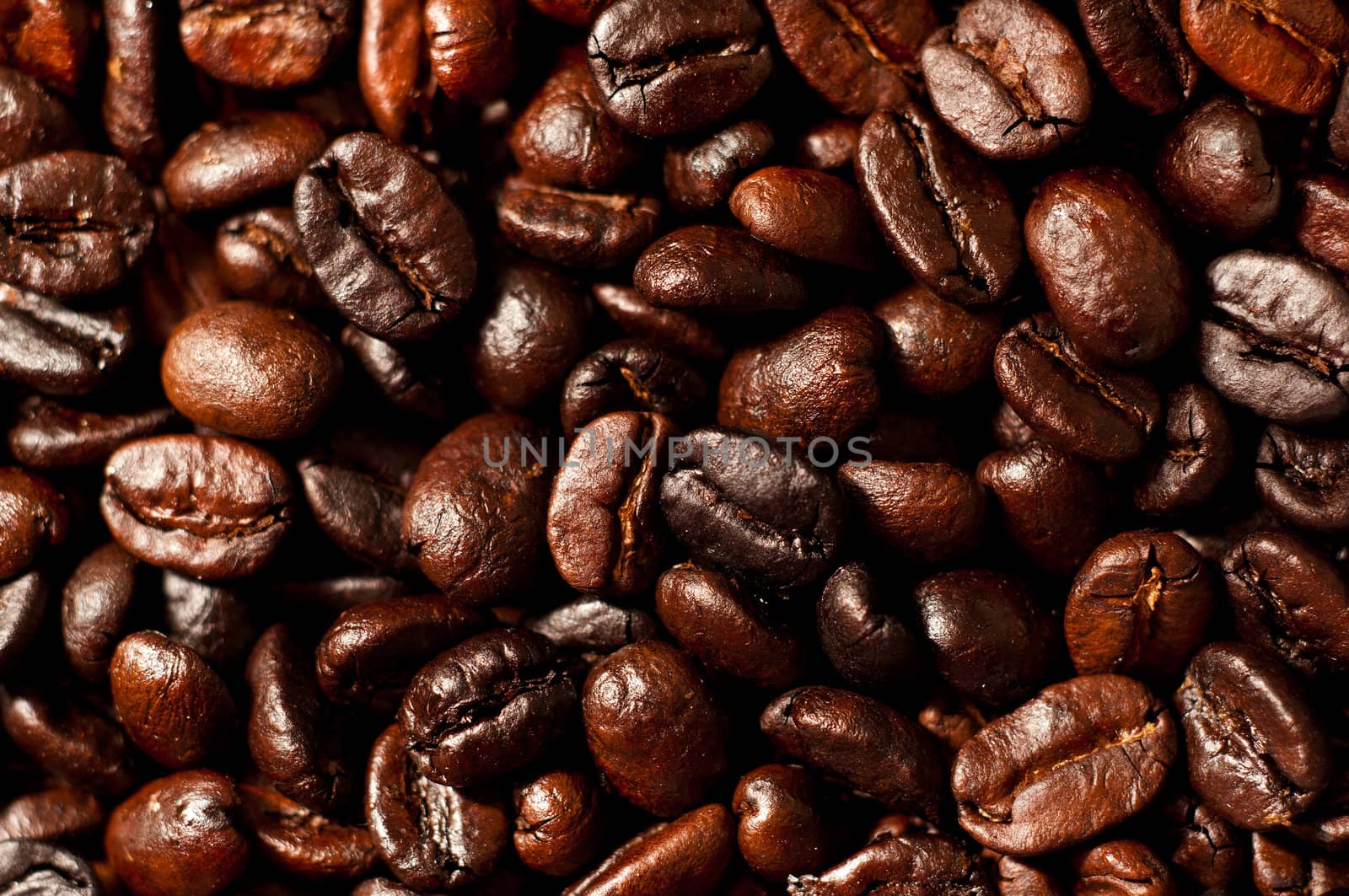 A closeup of home roasted Colombian coffee beans.