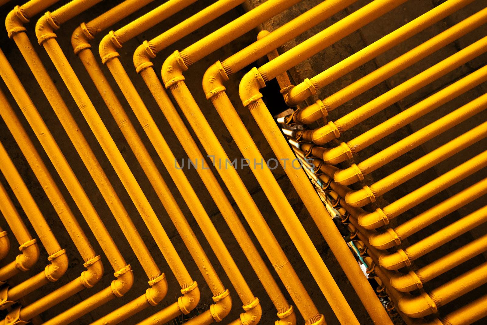 An image of yellow pipes forming an interesting pattern.
