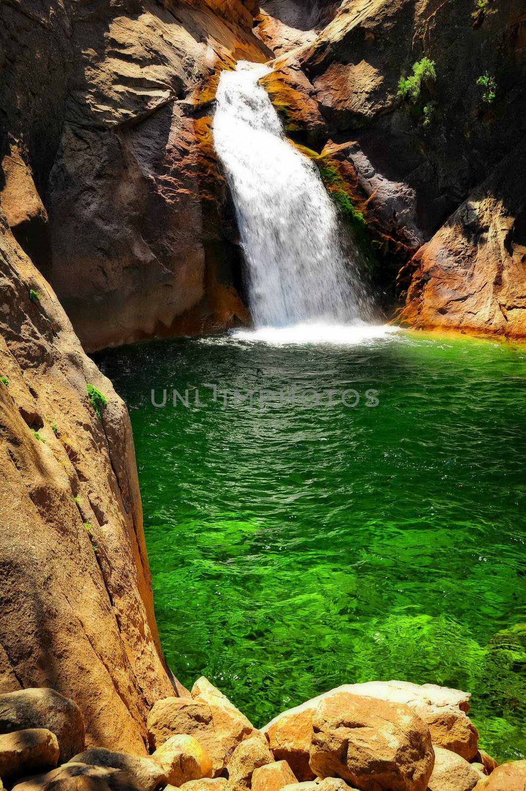 Waterfall with green water lake in Kings Canyon, USA