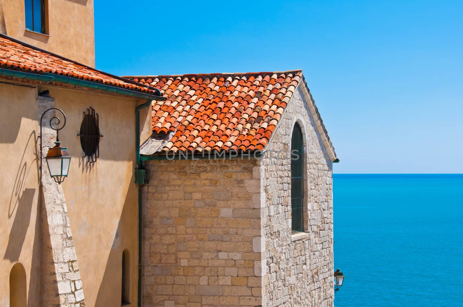 Historical building detail and ocean view with blue sky