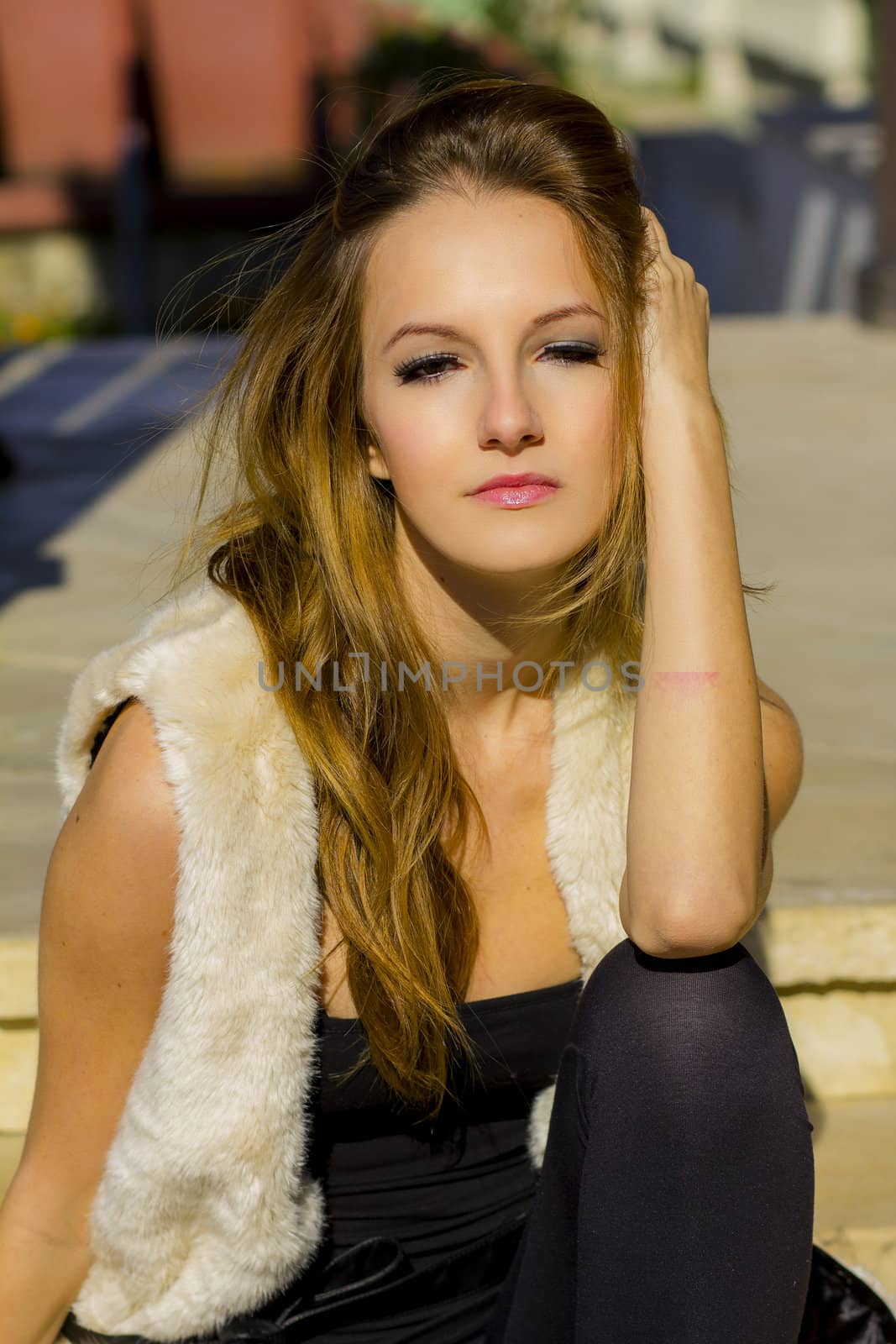 Young, beautiful woman in the city park