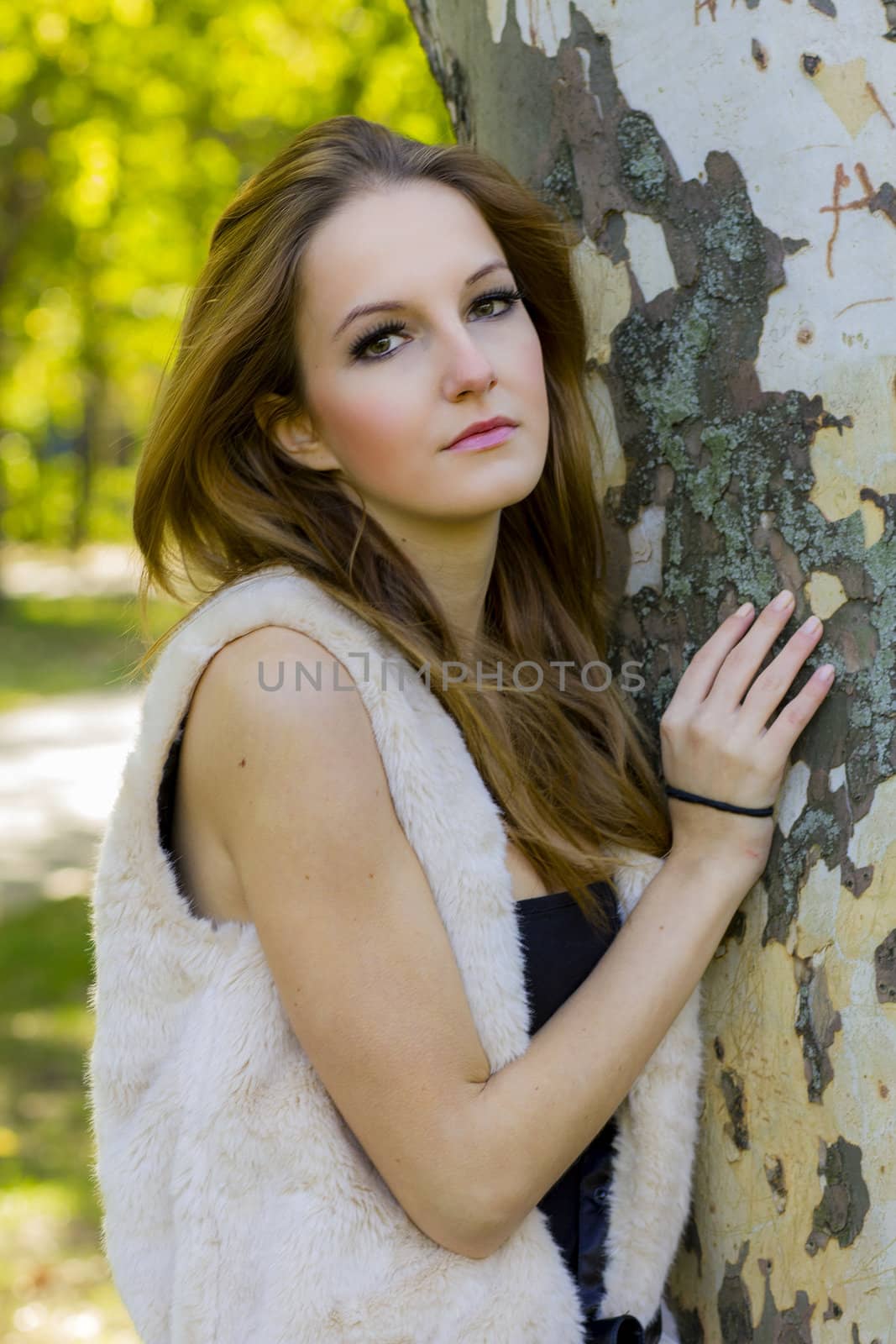 Young, beautiful woman in the city park