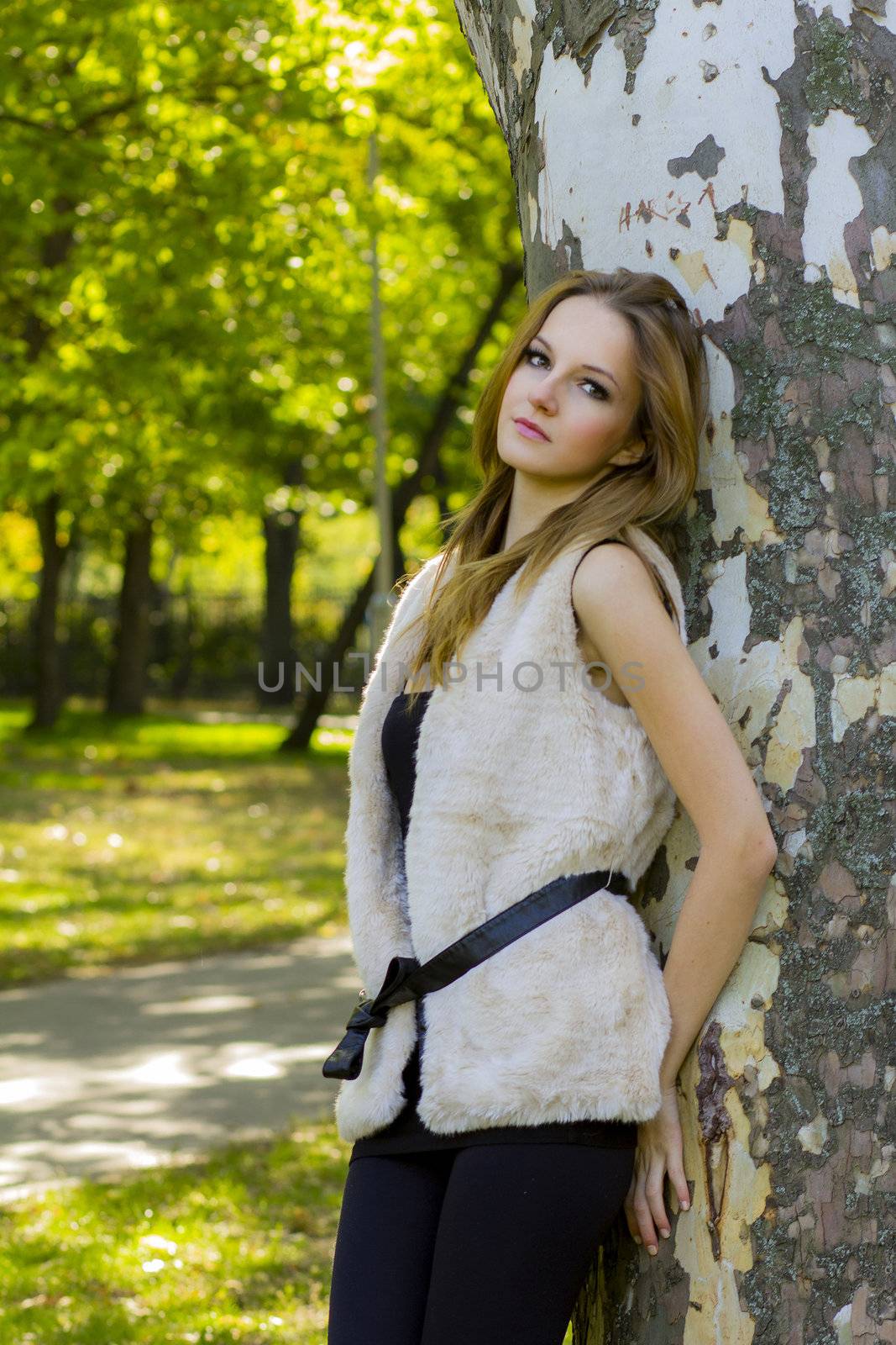 Young, beautiful woman in the city park