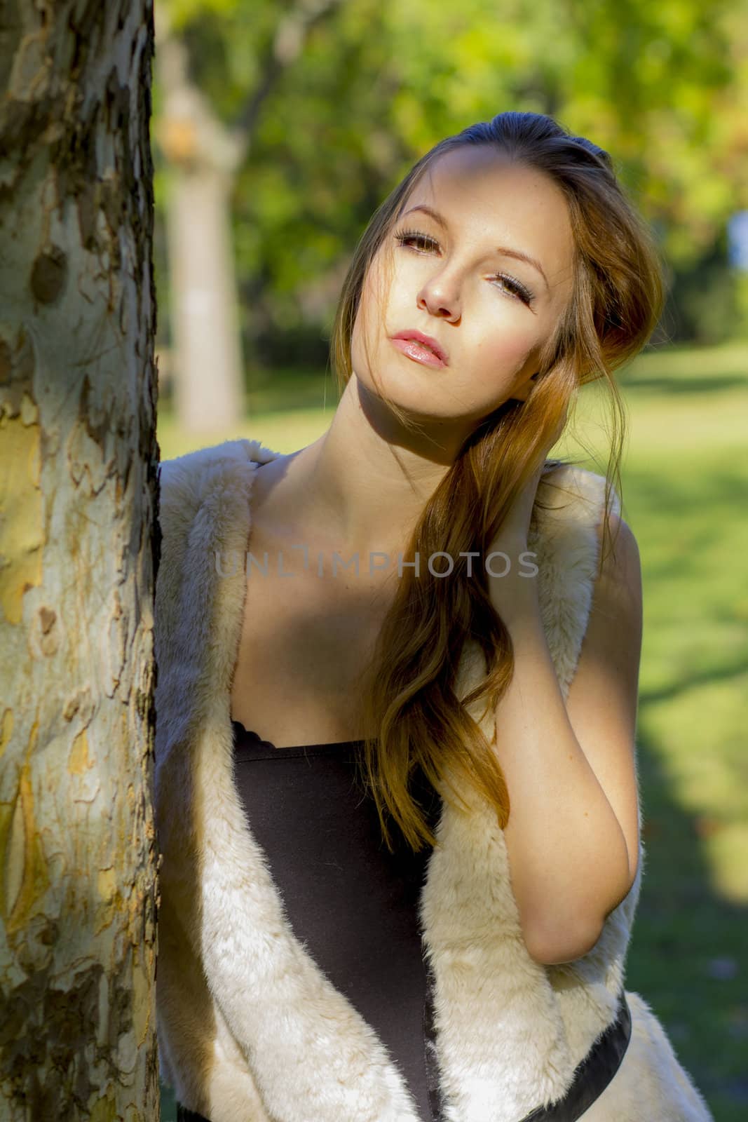 Young, beautiful woman in the city park