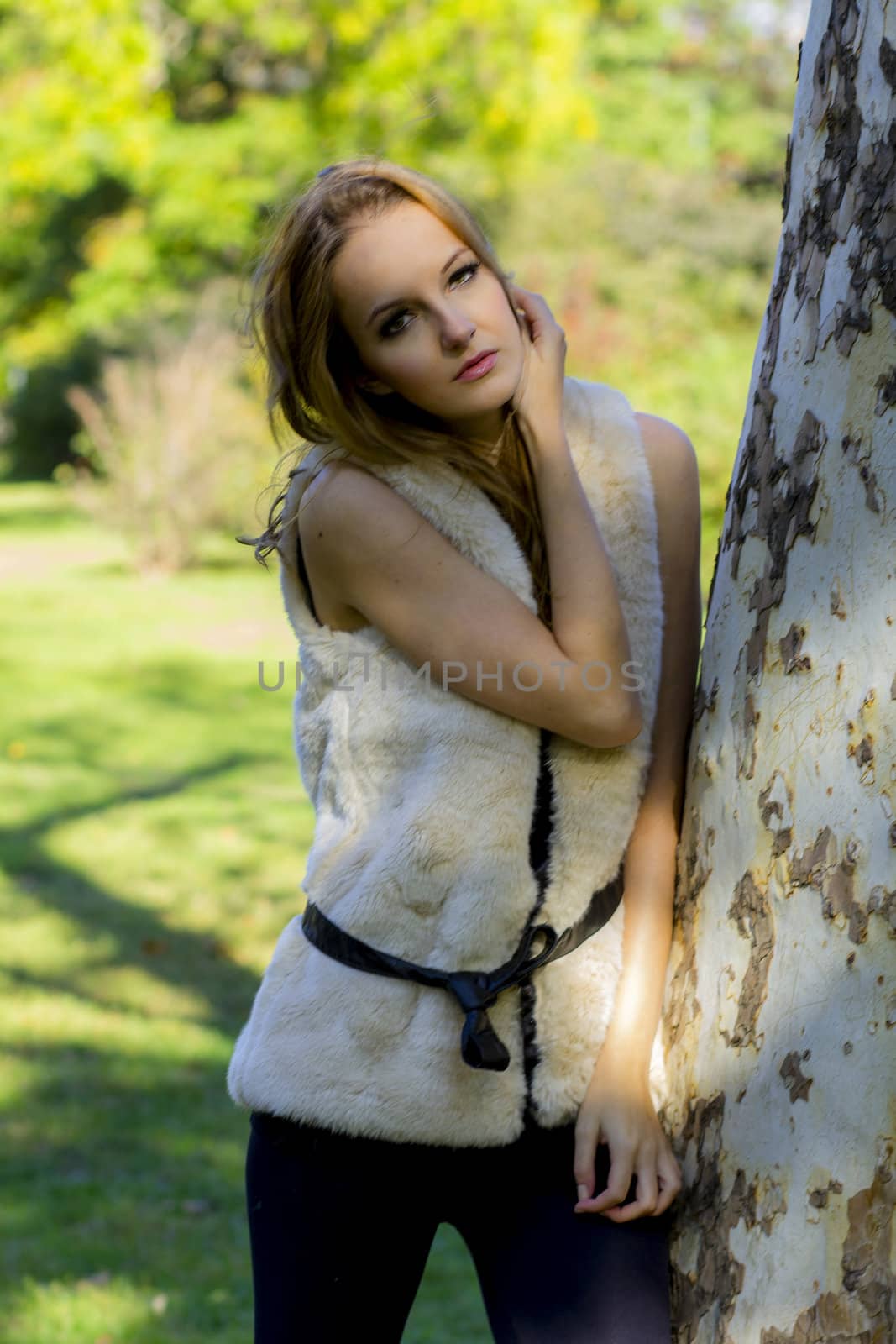 Young, beautiful woman in the city park