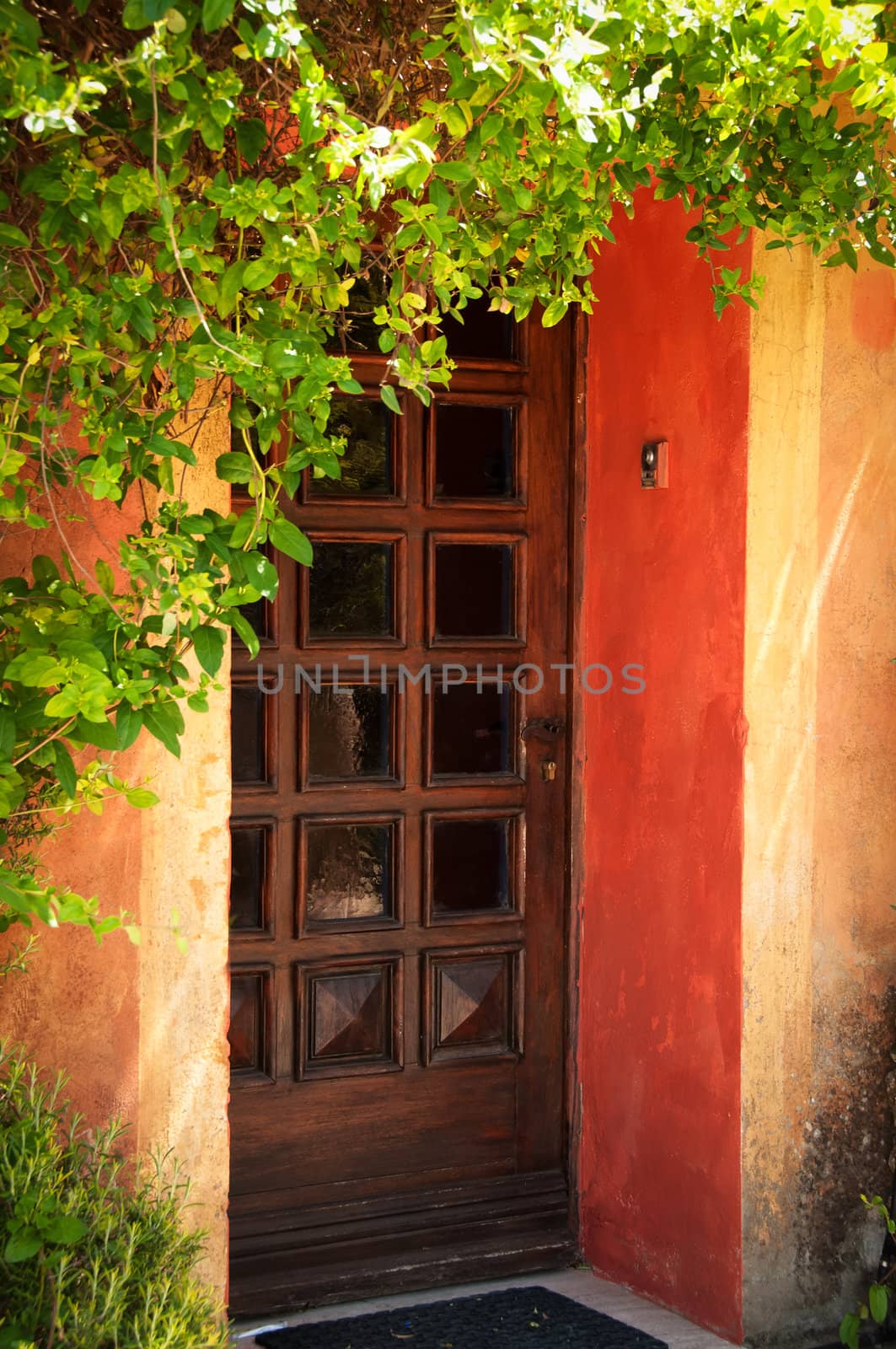 Colorful Provence orange house entrance door detail view