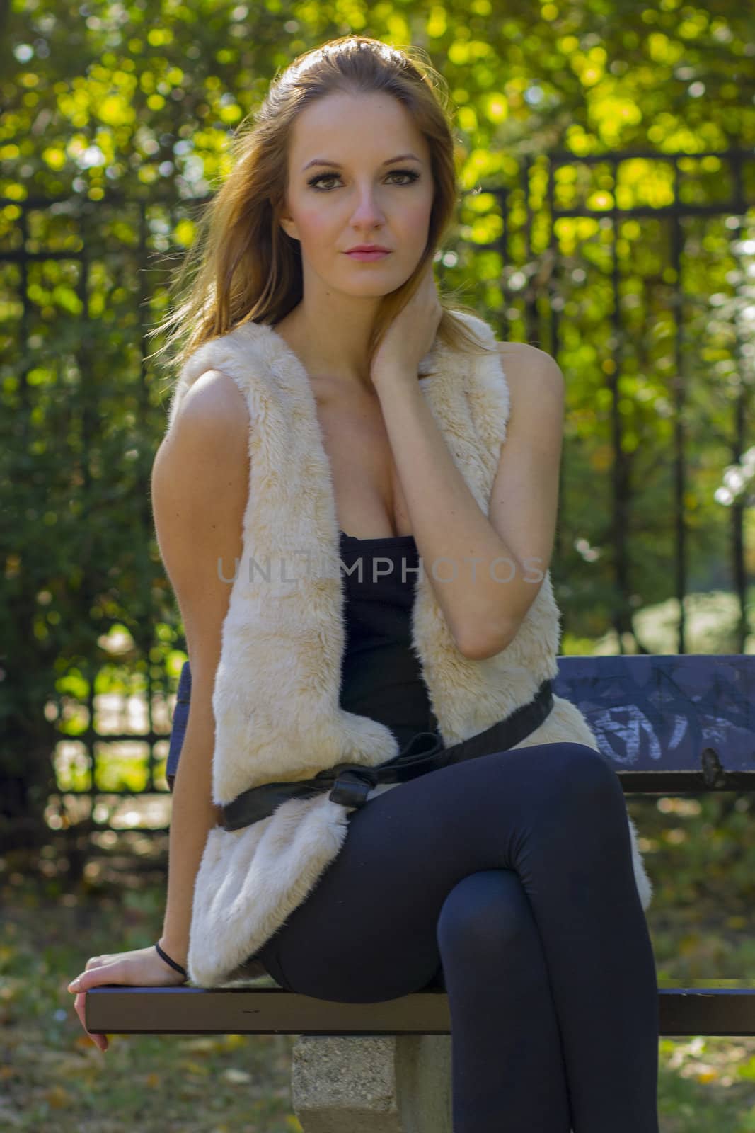 Young, beautiful woman in the city park