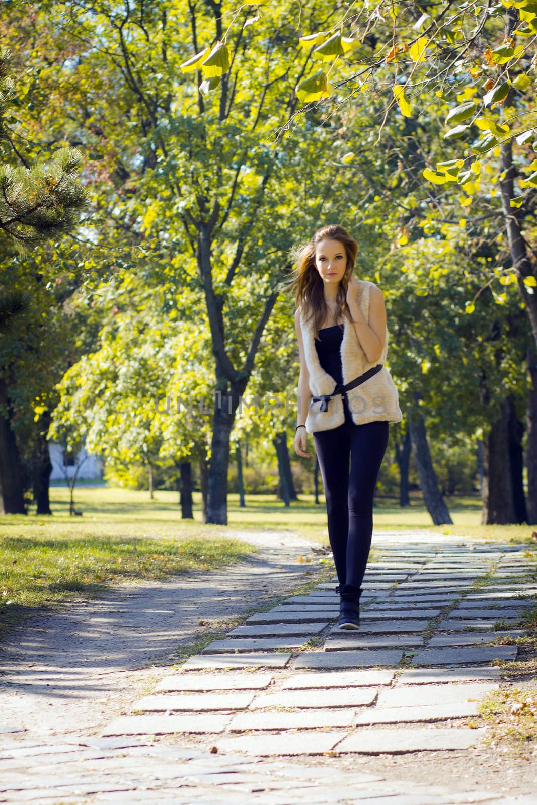 Young, beautiful woman in the city park