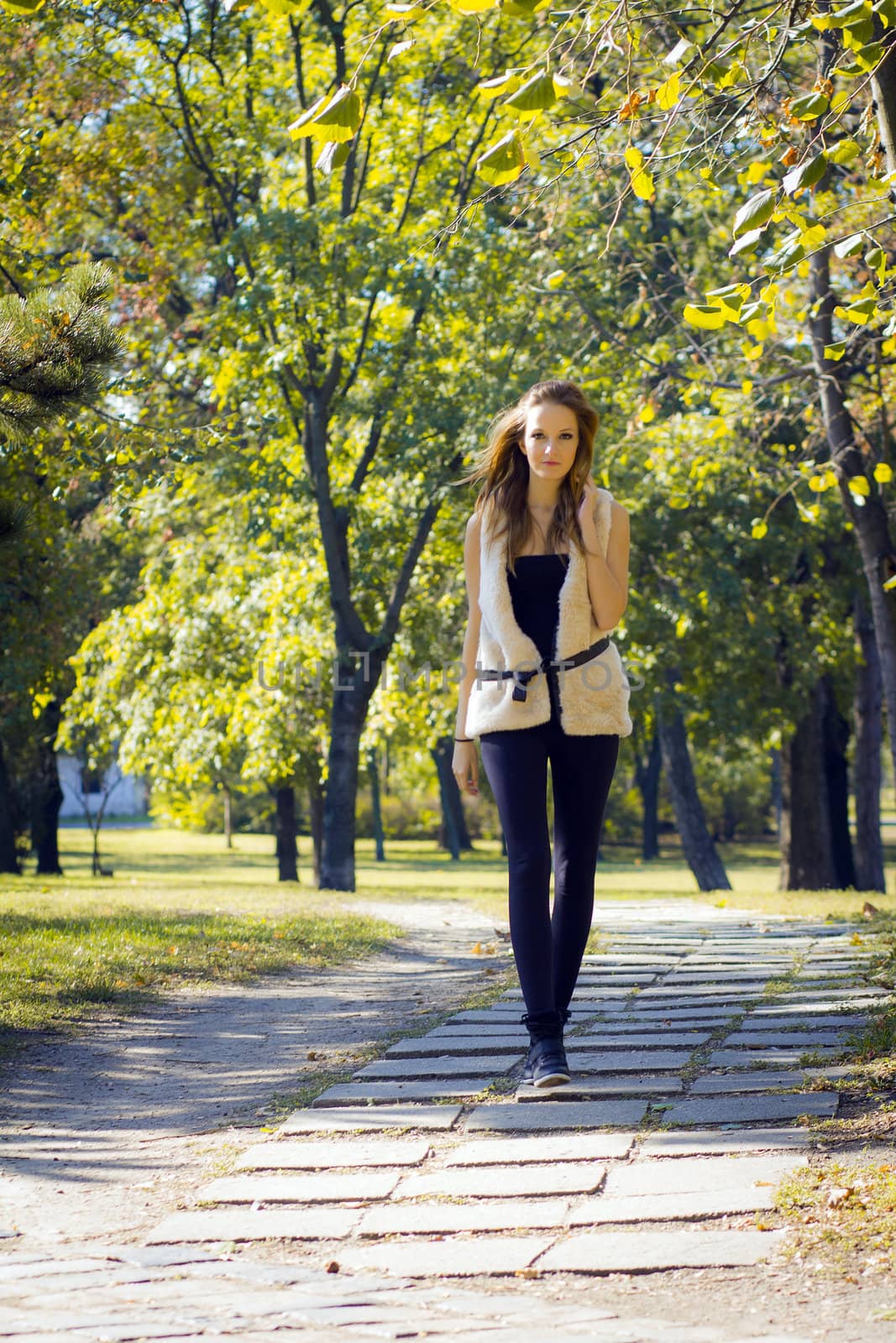 Young, beautiful woman in the city park