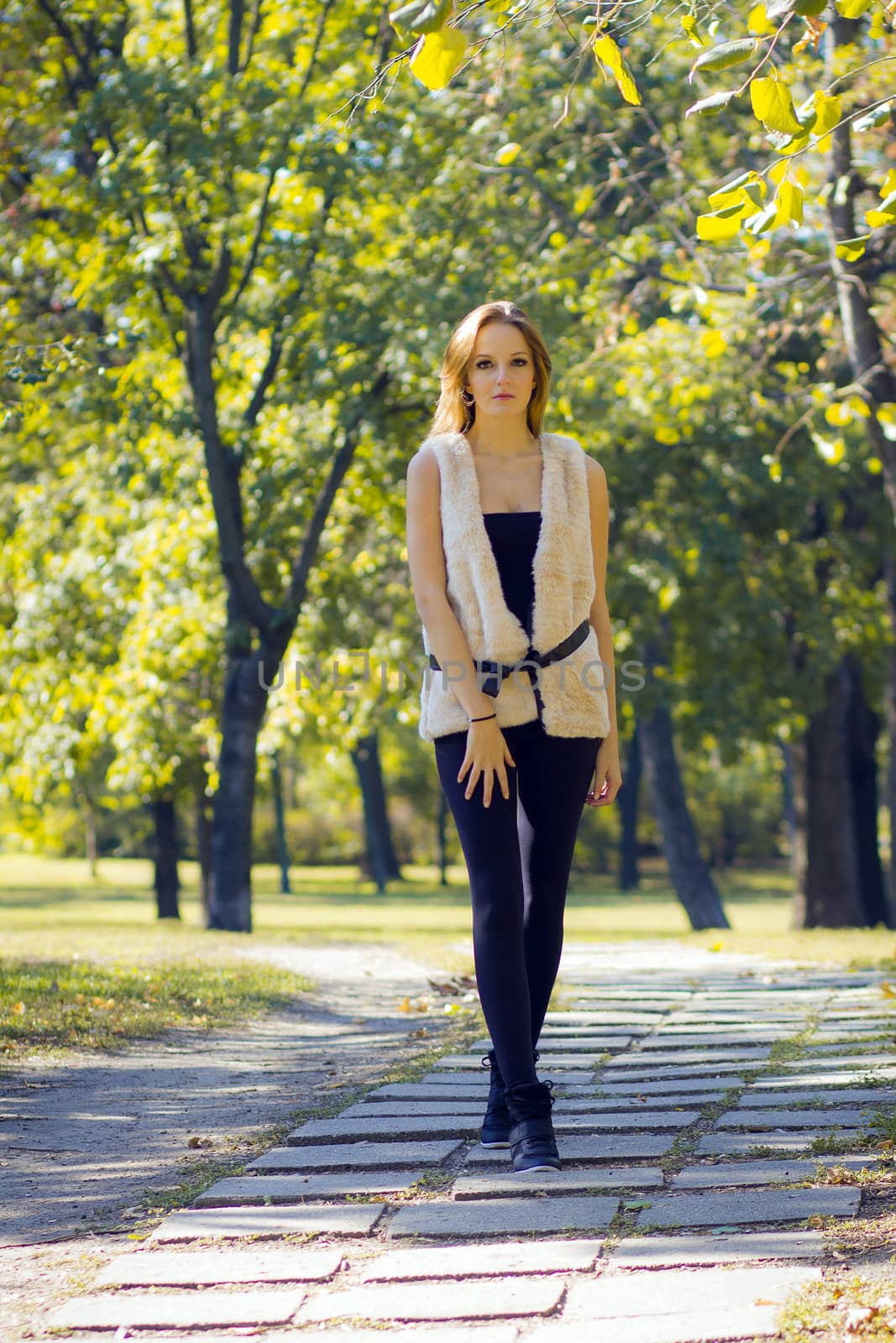 Young, beautiful woman in the city park