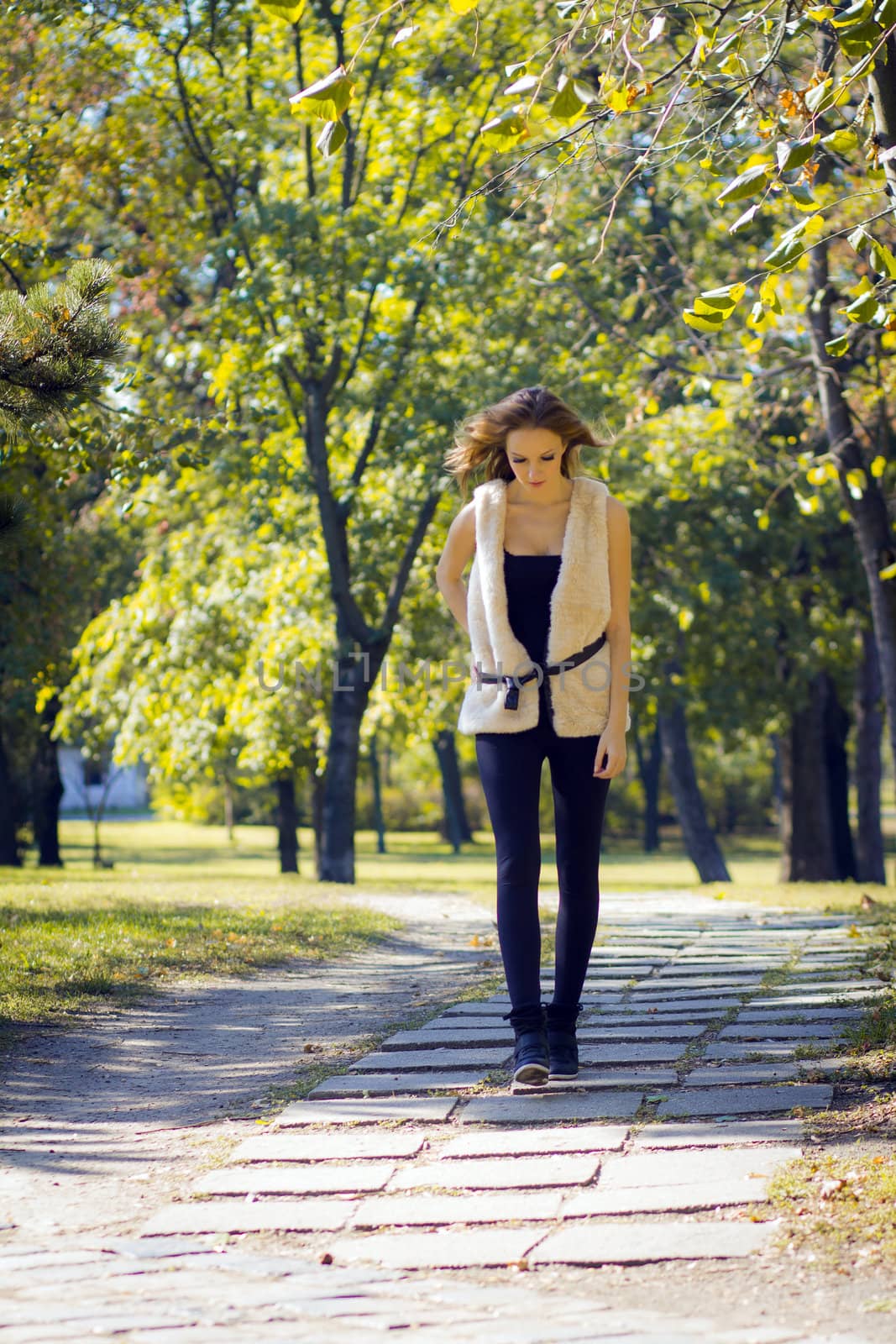 Young, beautiful woman in the city park